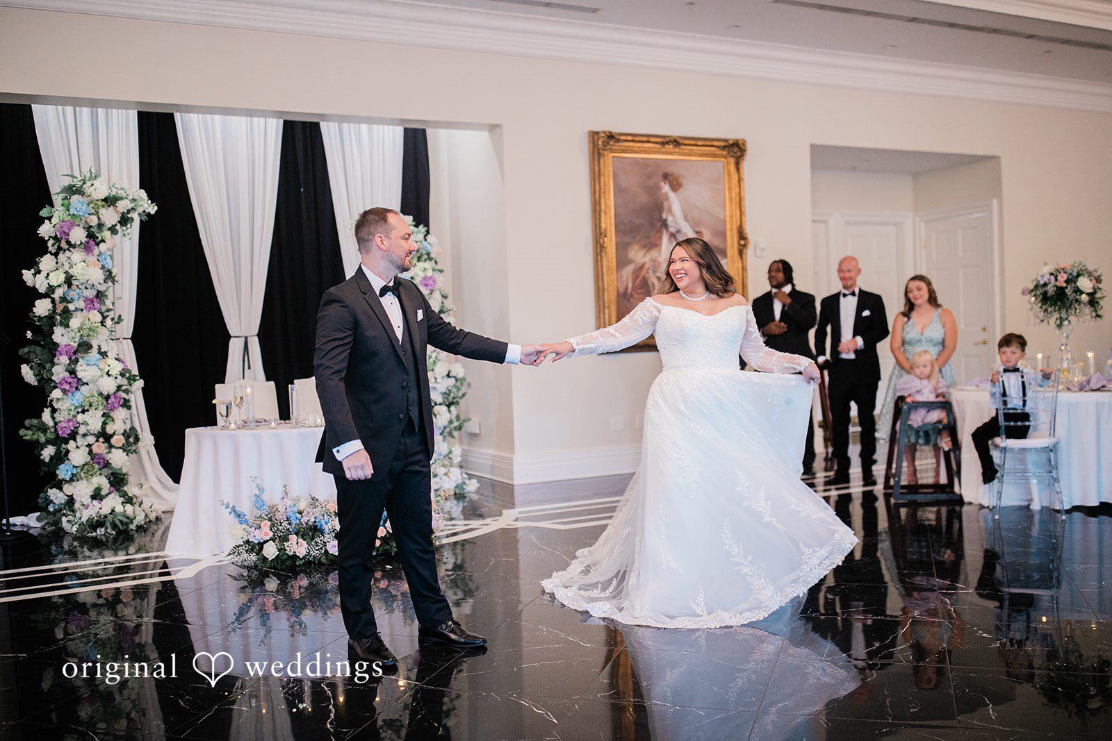 The couple takes their first dance