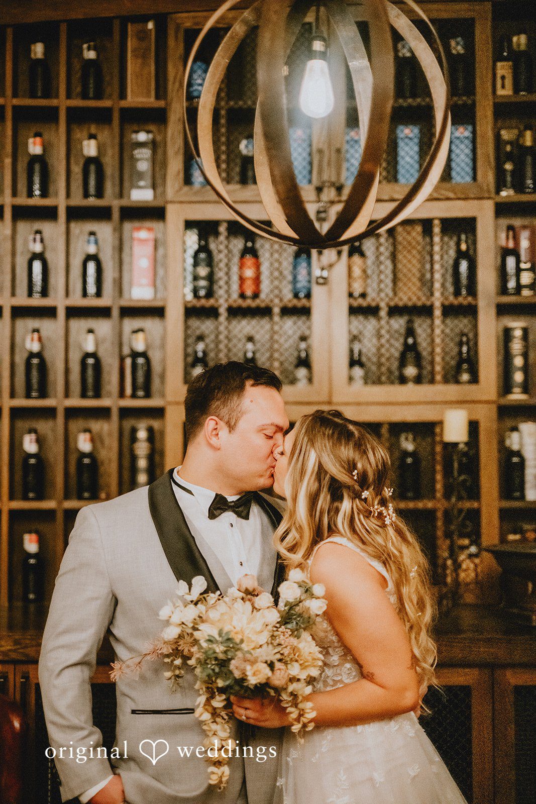 The couple shares a kiss at Goose Island Barrel House