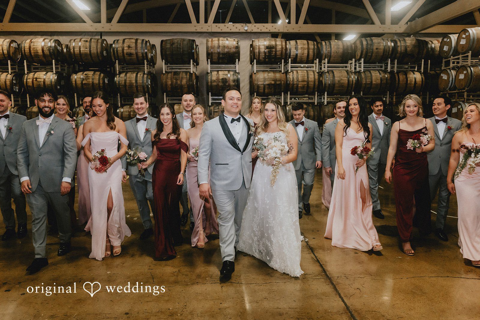 Our Chicago wedding photographers at Original Weddings captured a stunning portrait of the couple and their bridal party at the Goose Island Barrel House