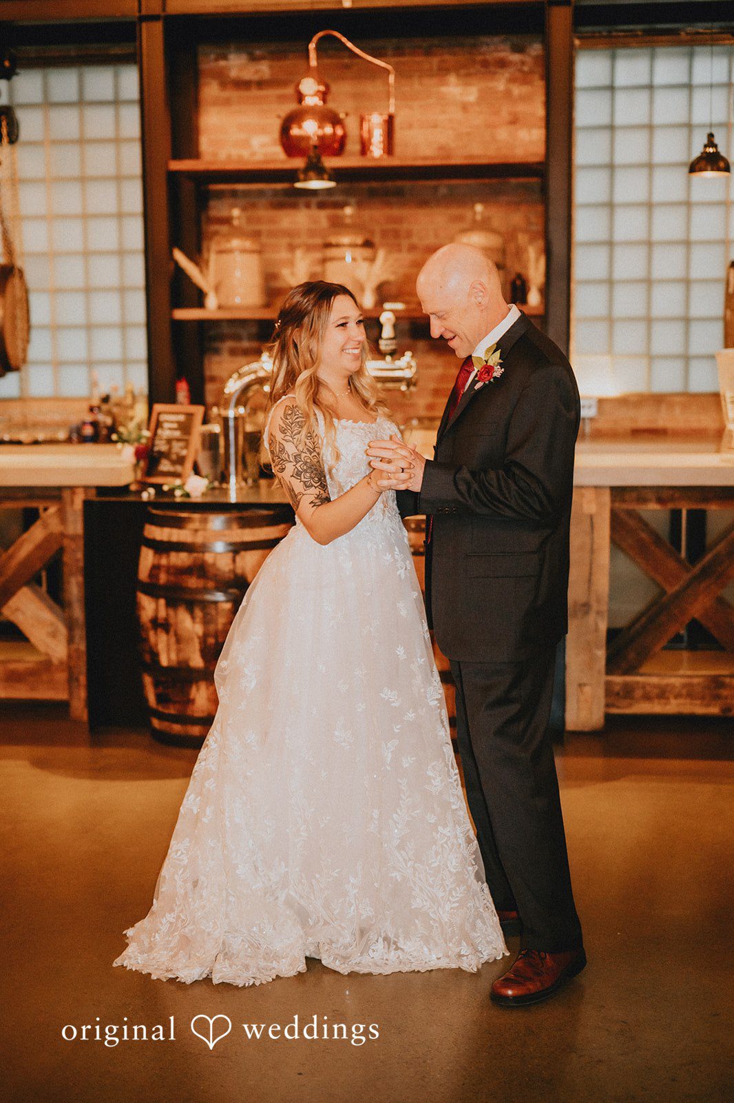 The bride dances with her father