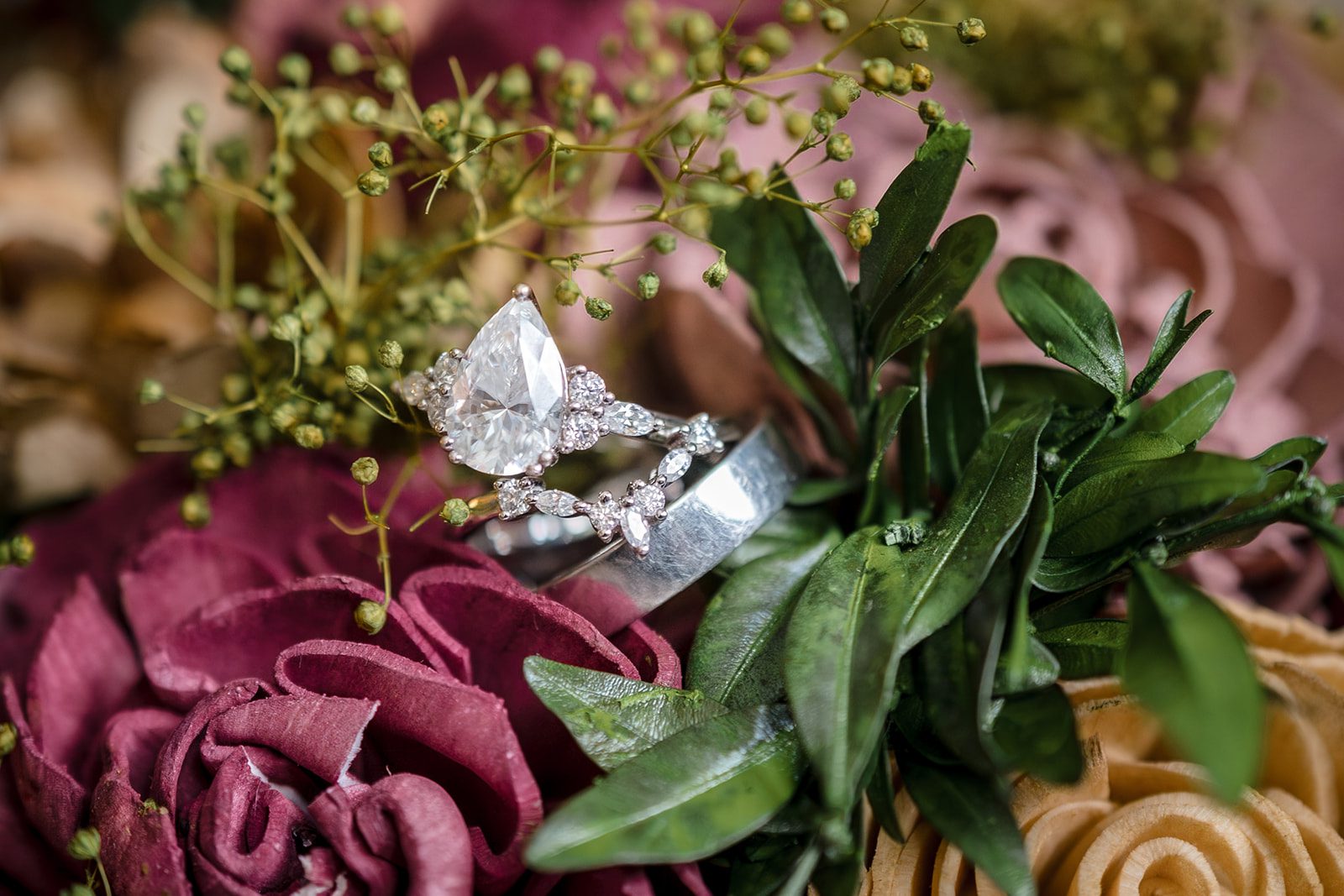Tiare + Jeremy Romantic wedding ring detail shot with elegant floral styling