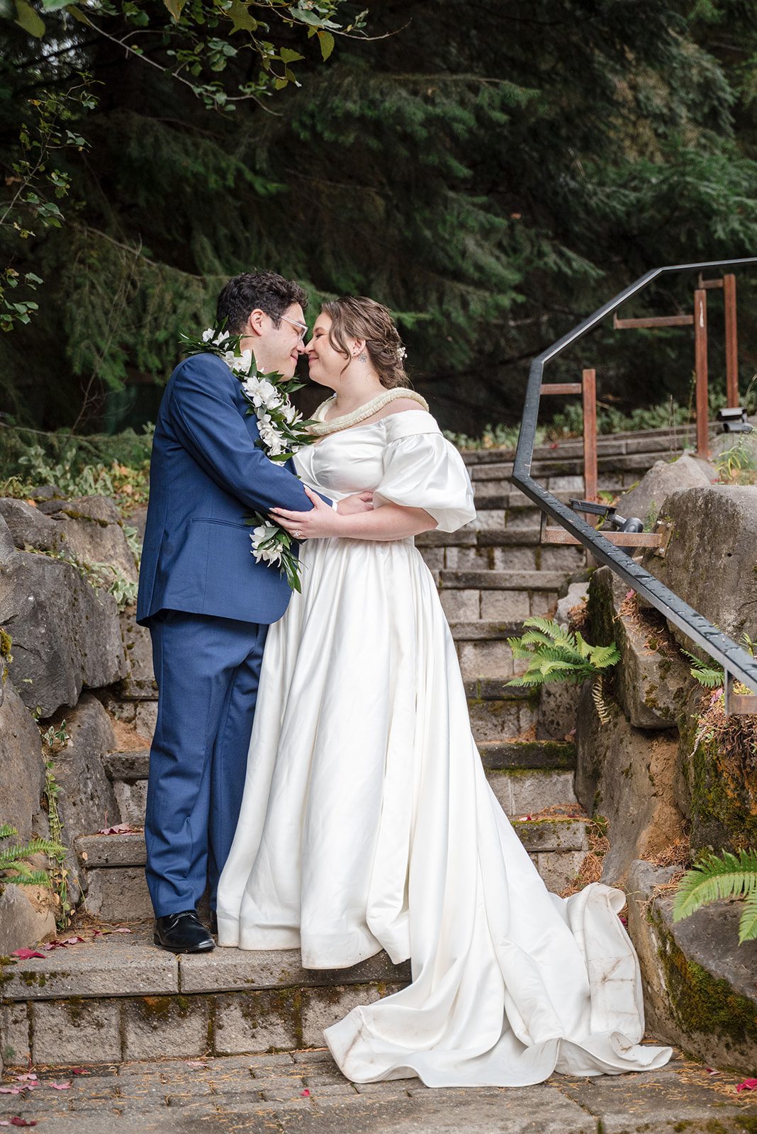 Tiare + Jeremy Romantic outdoor wedding portrait of newlyweds standing closely together