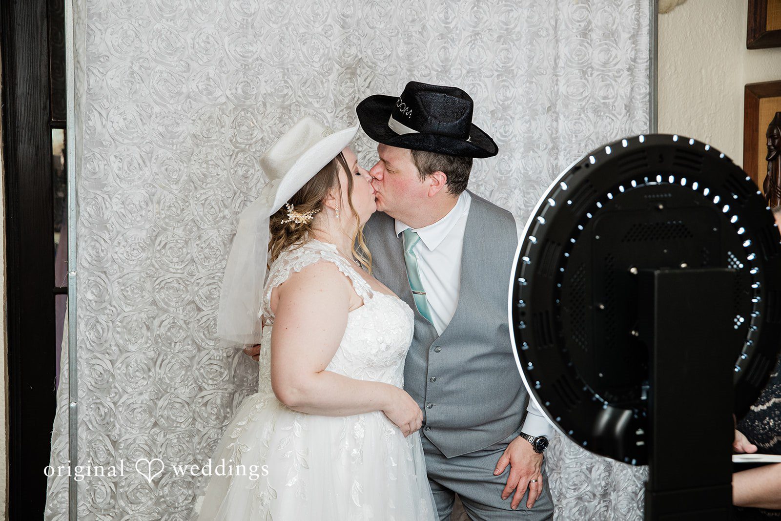 Nicole + Greg The couple shares a romantic kiss
