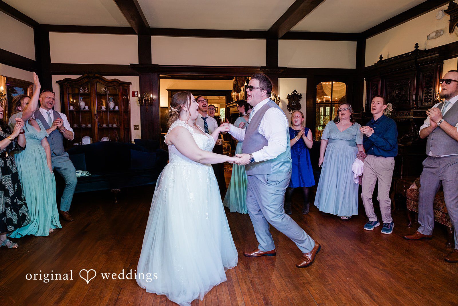 Nicole + Greg The couple dances happily at the wedding reception