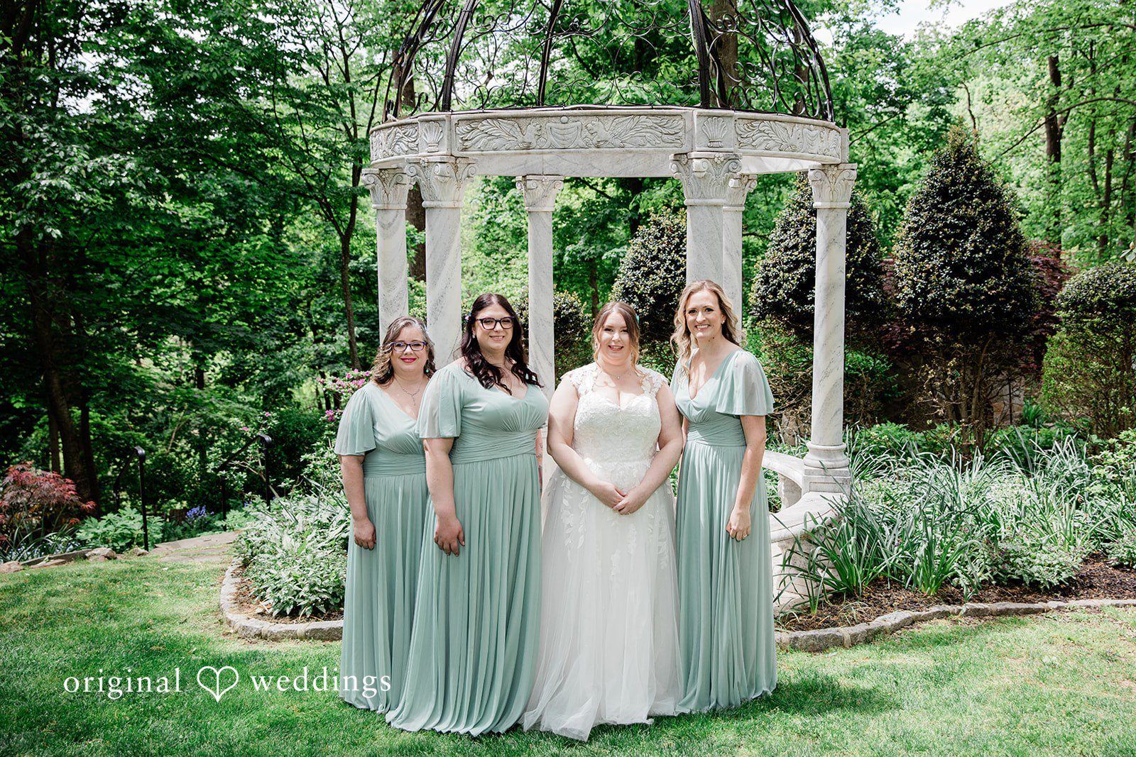 Nicole + Greg A portrait of the bride and her bridesmaids