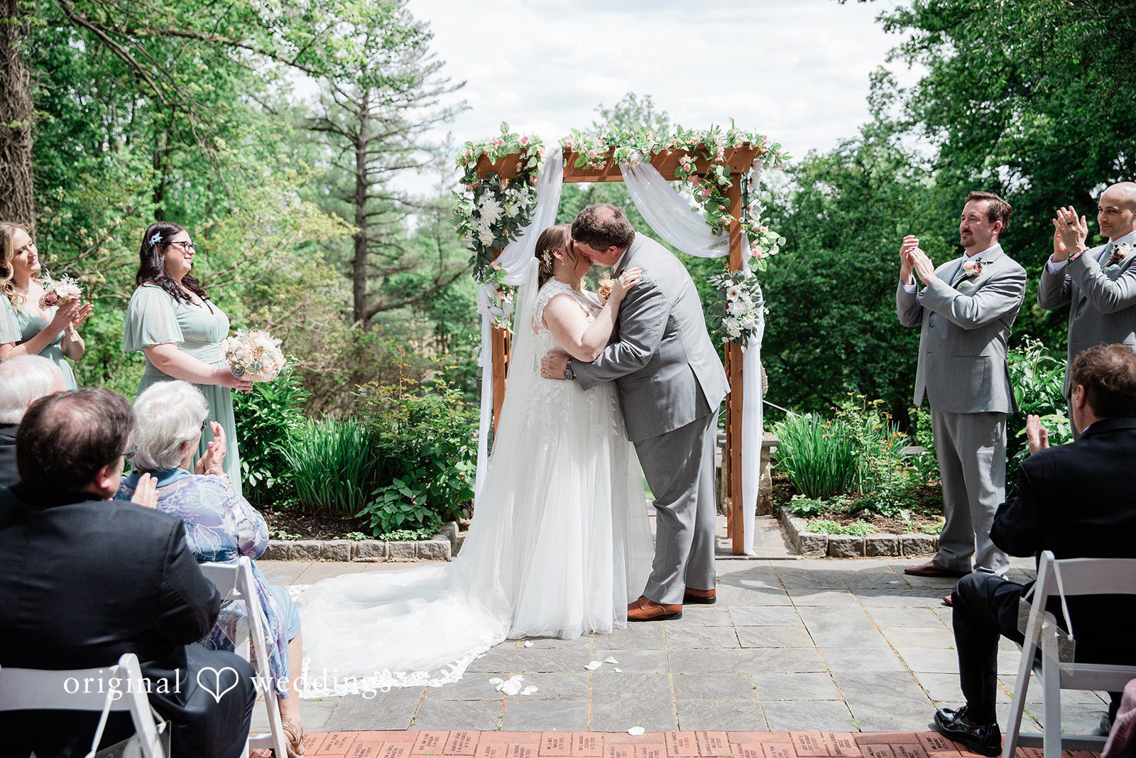 Nicole + Greg The couple shares a romantic kiss