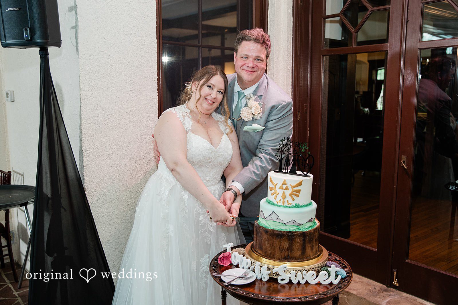 Nicole + Greg The couple cuts their wedding cake