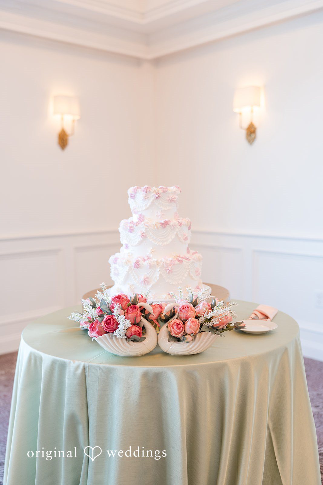 Vanessa + Bryant The wedding cake adorned with delicate florals