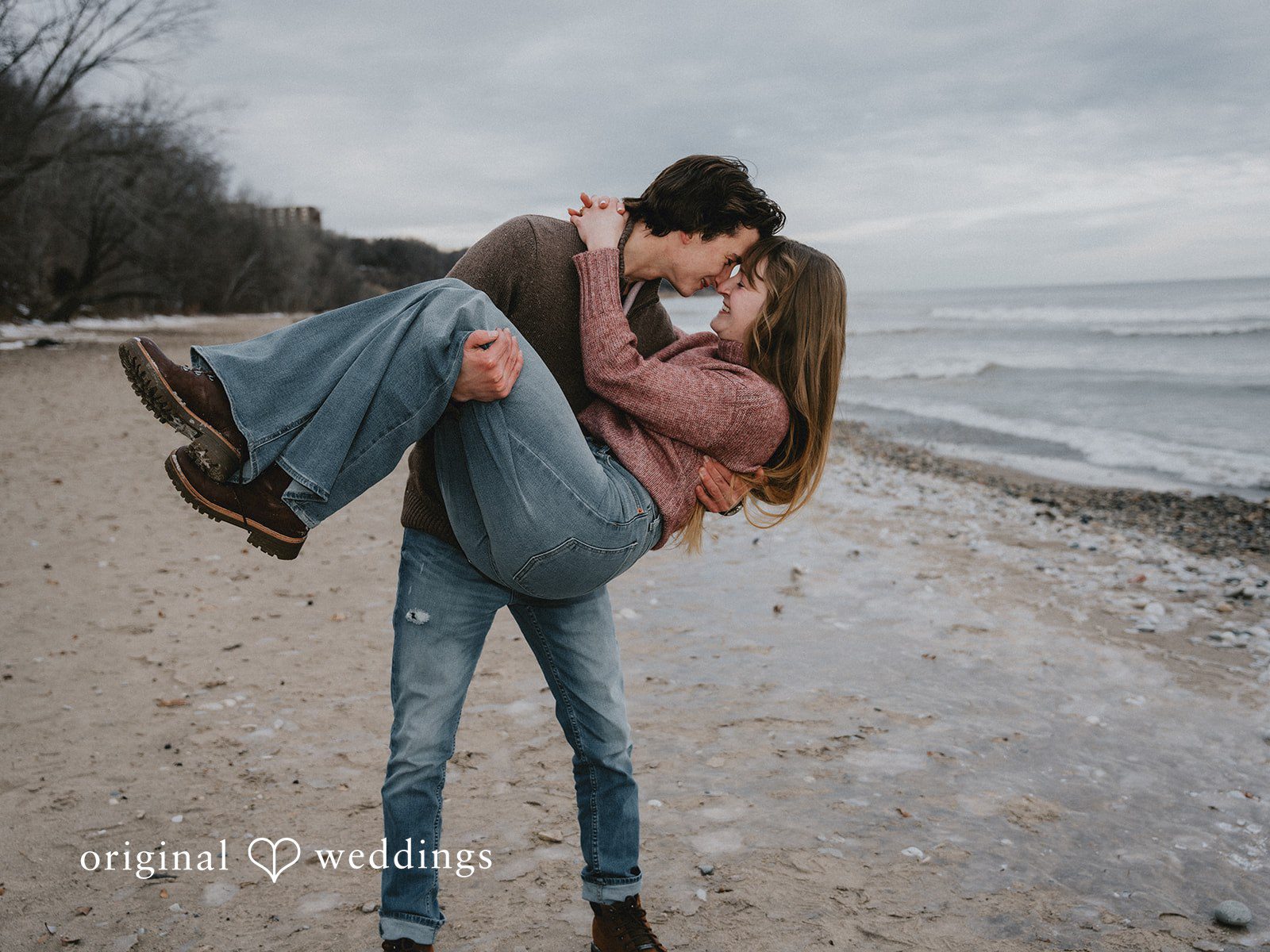 Lovely picture of groom holding bride in his arms