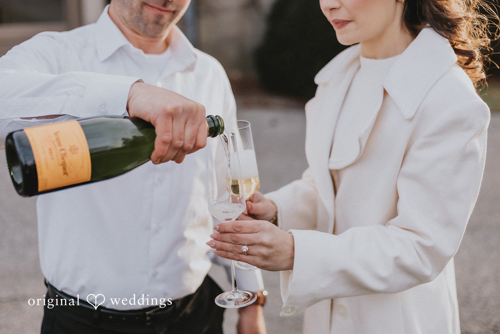 A close-up shot of the couple sharing a drink
