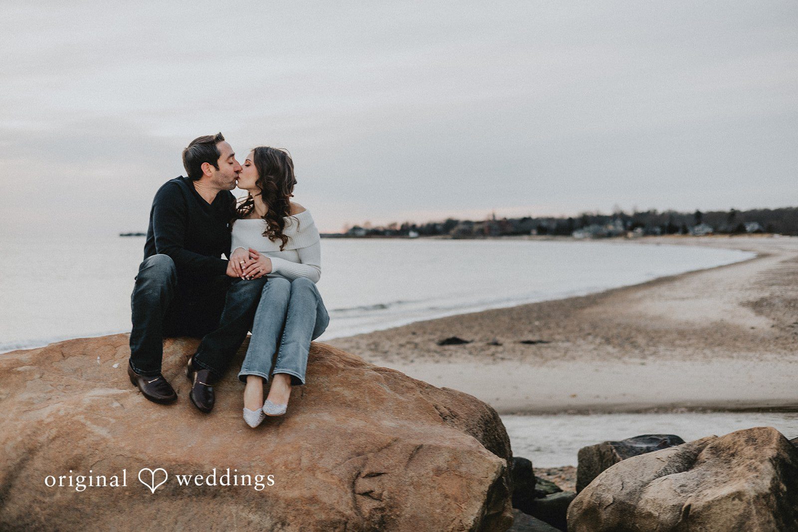 A couple shares a romantic kiss