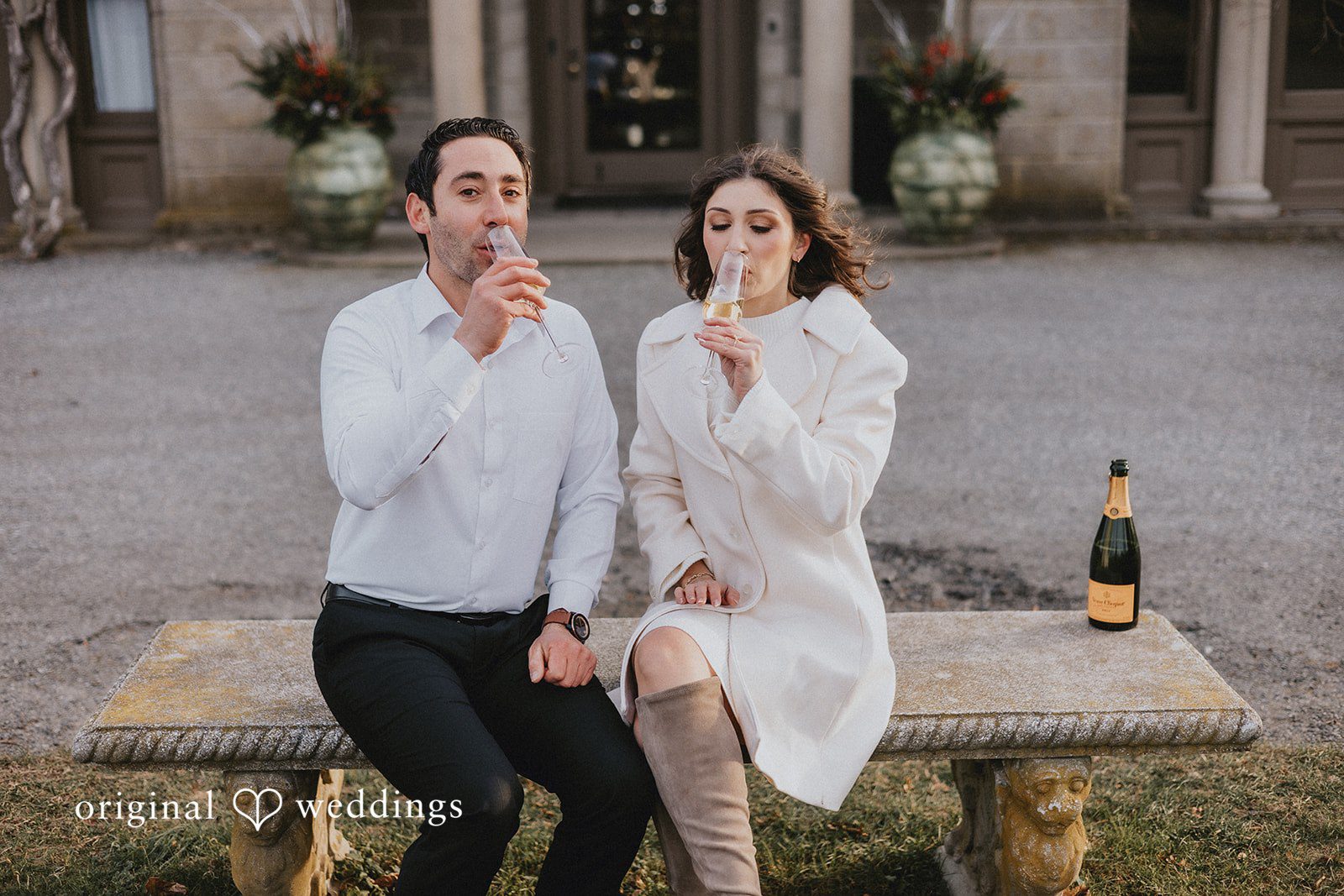The couple drinks the champagne from the glass