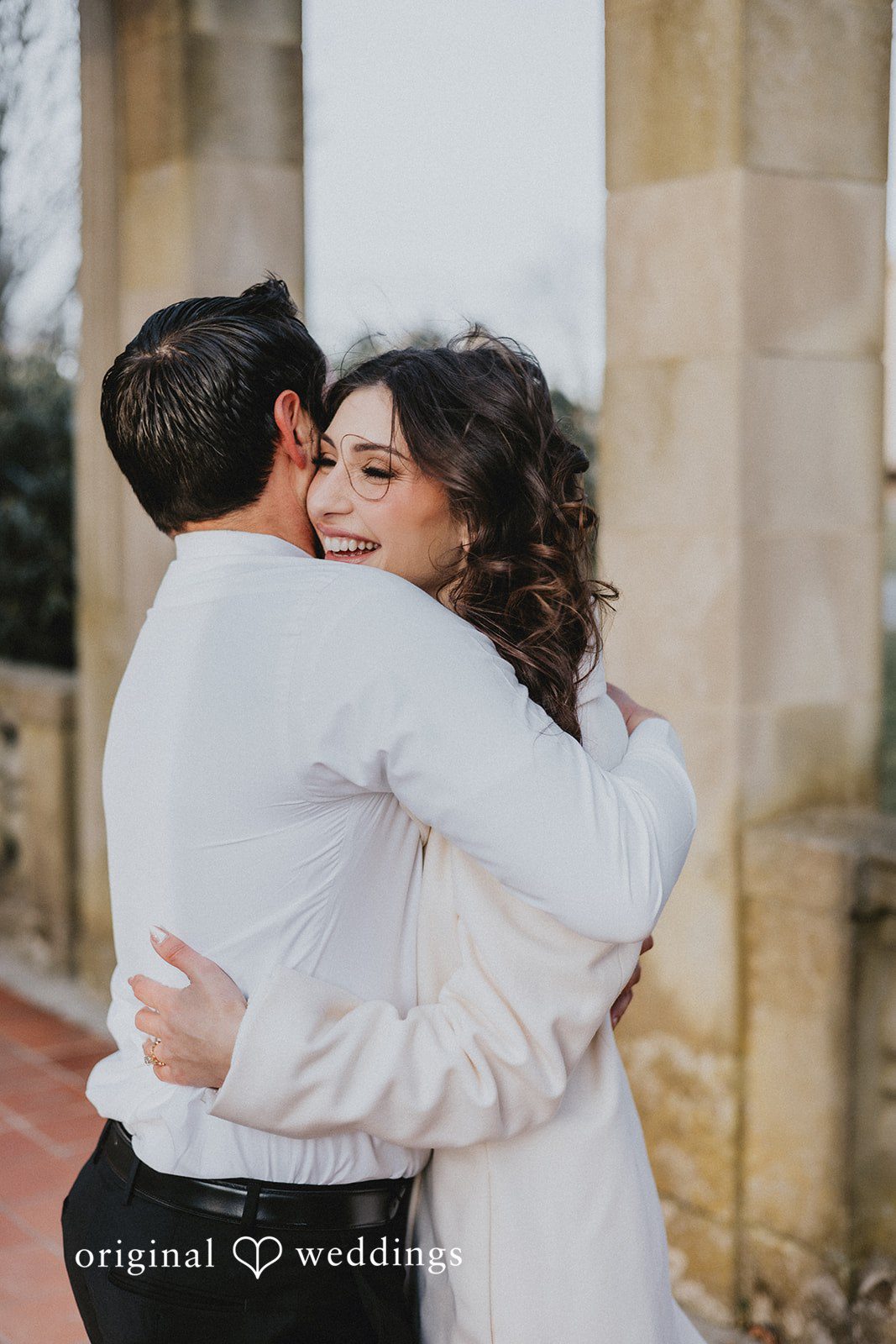 The couple shares a hug