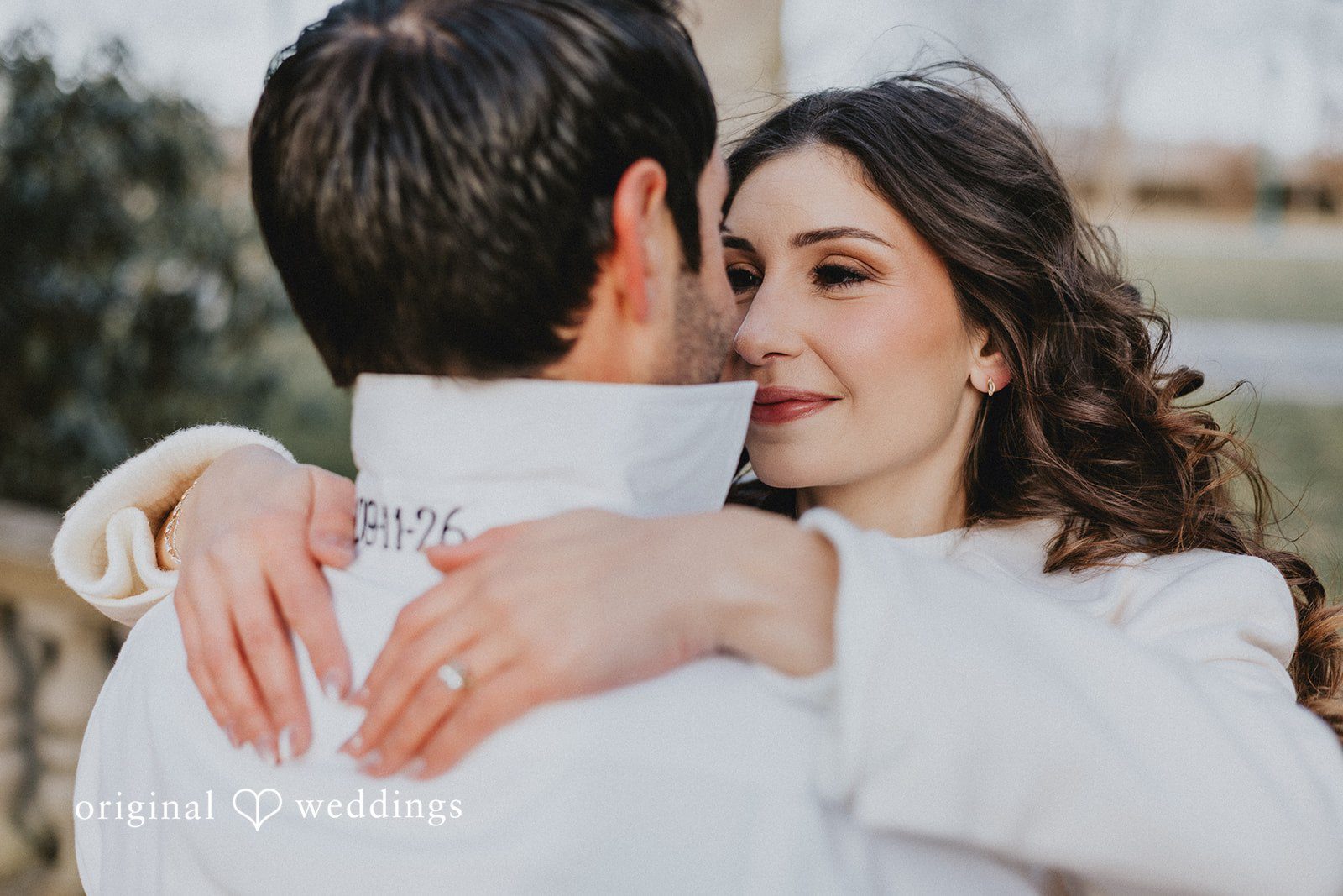 The couple shares a passionate hug