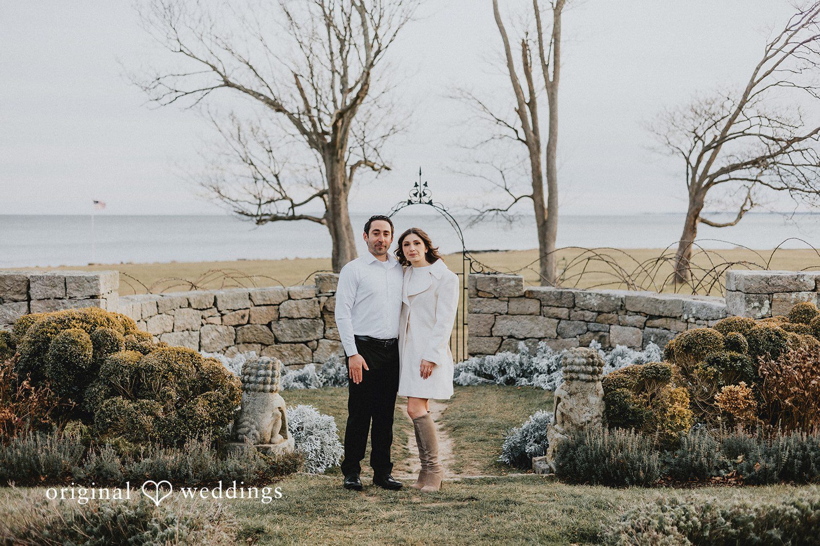 A beautiful portrait of the couple by the stone terrace
