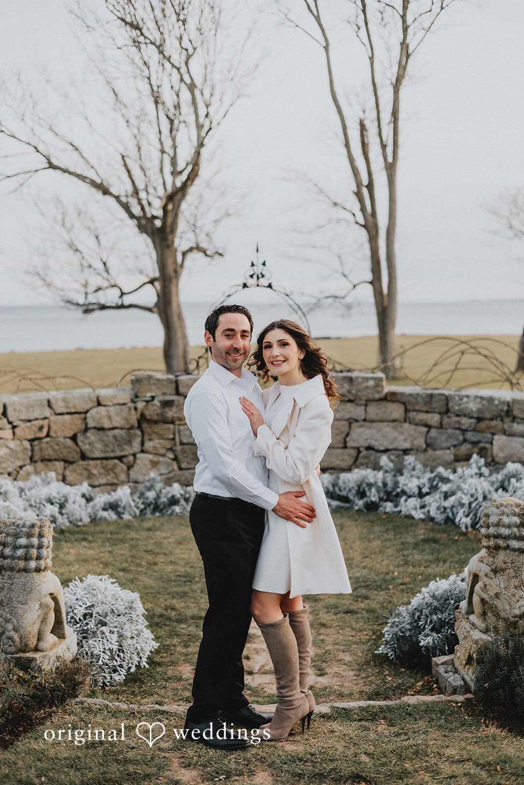 A stunning portrait of the couple by the stone terrace