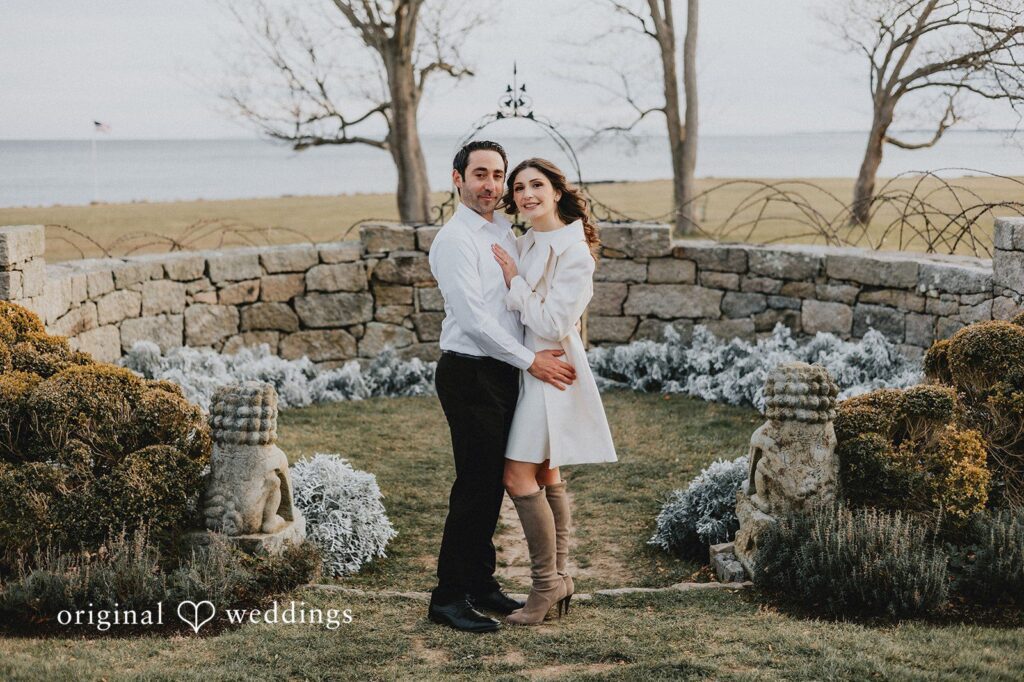 Our CT engagement photographers at Original Weddings captured a stunning portrait of the couple by the stone terrace at Harkness Memorial State Park