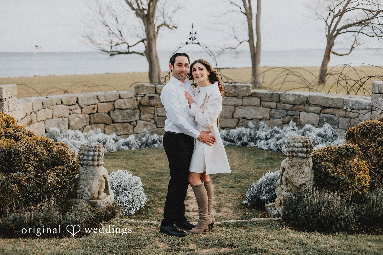 Our CT engagement photographers at Original Weddings captured a stunning portrait of the couple by the stone terrace at Harkness Memorial State Park
