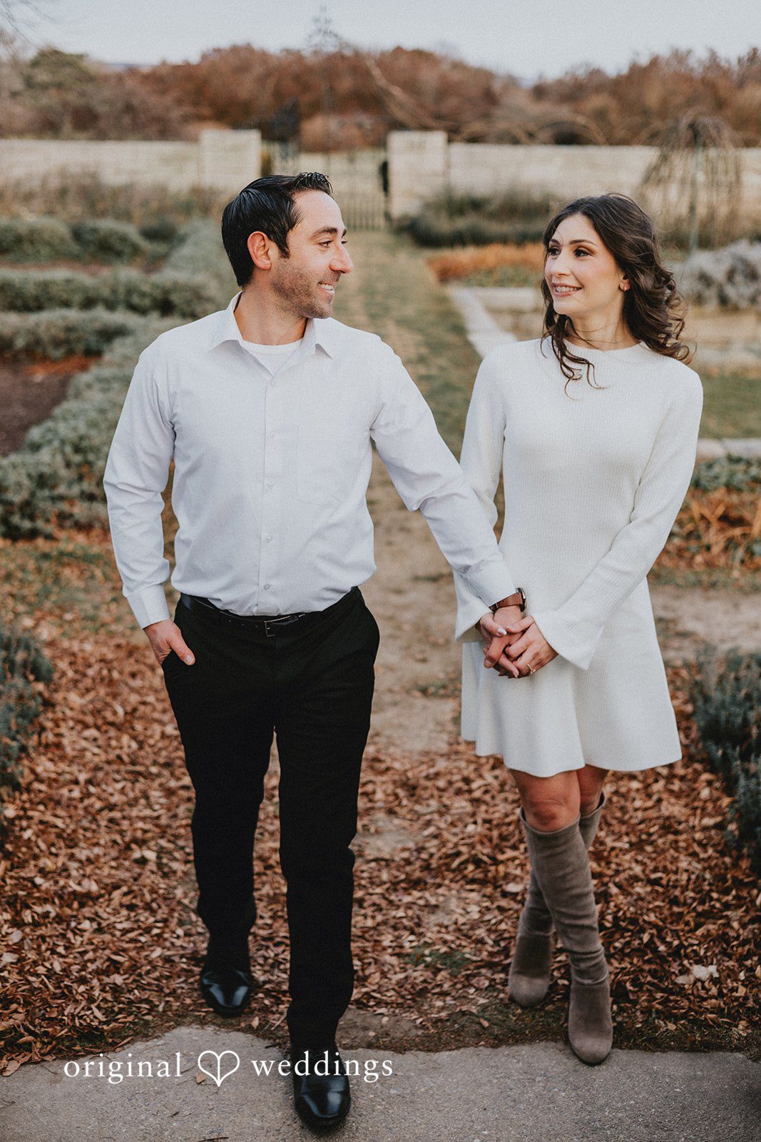 A stunning portrait of the couple taking a walk at the venue