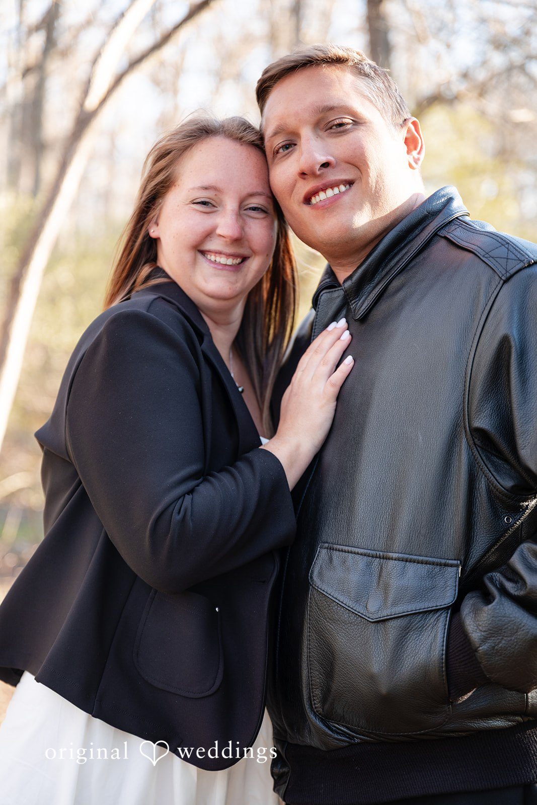 Joyful couple pose during photoshoot at Holcomb Gardens