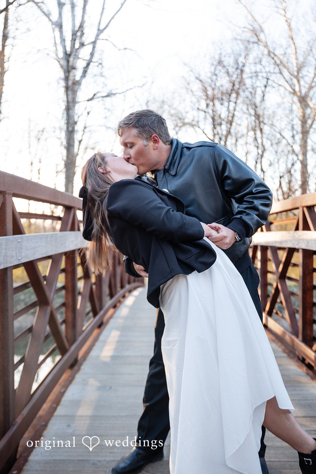 Emotional couple kiss portrait outdoors at Holcomb Gardens