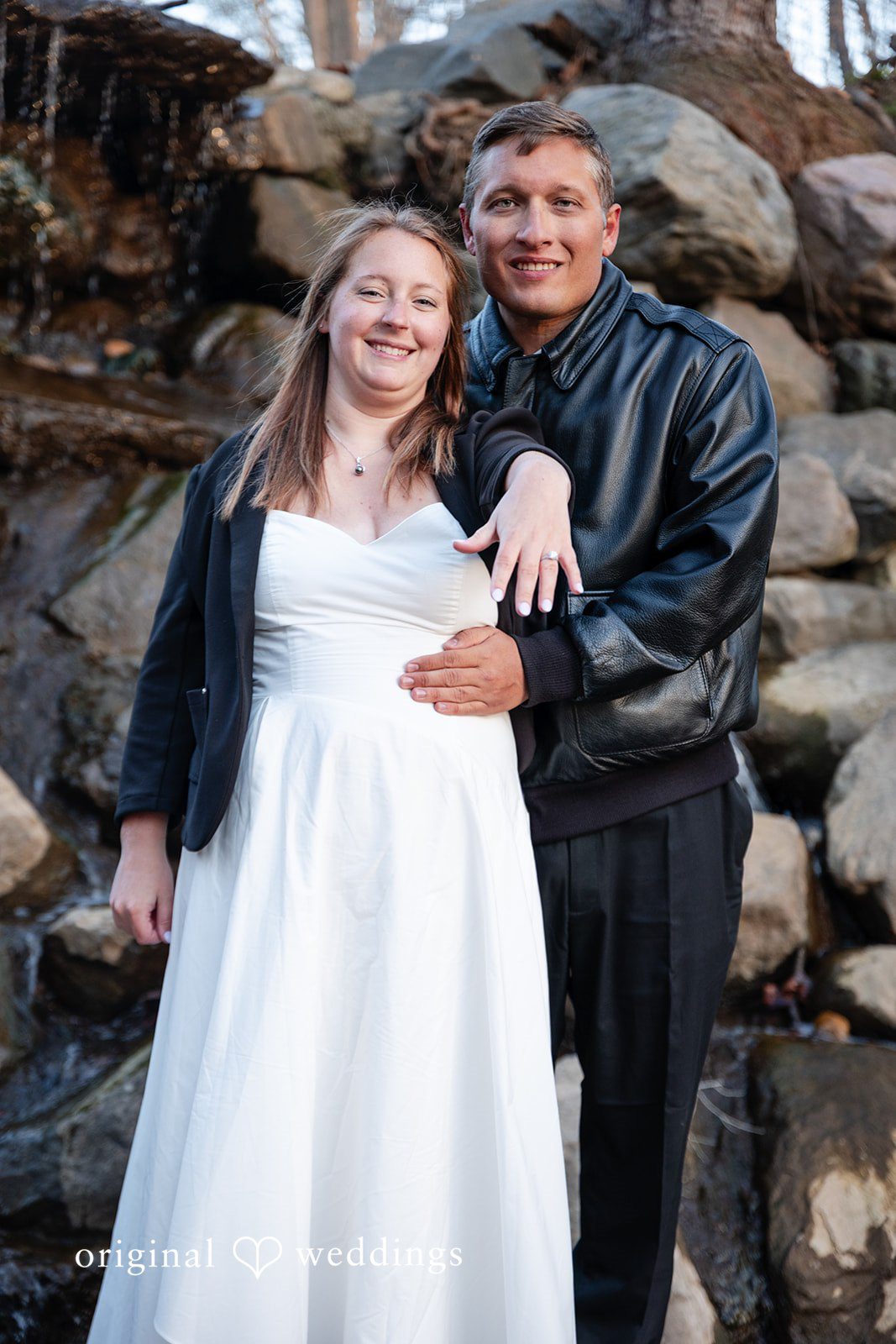 Elegant bride showing ring during engagement session