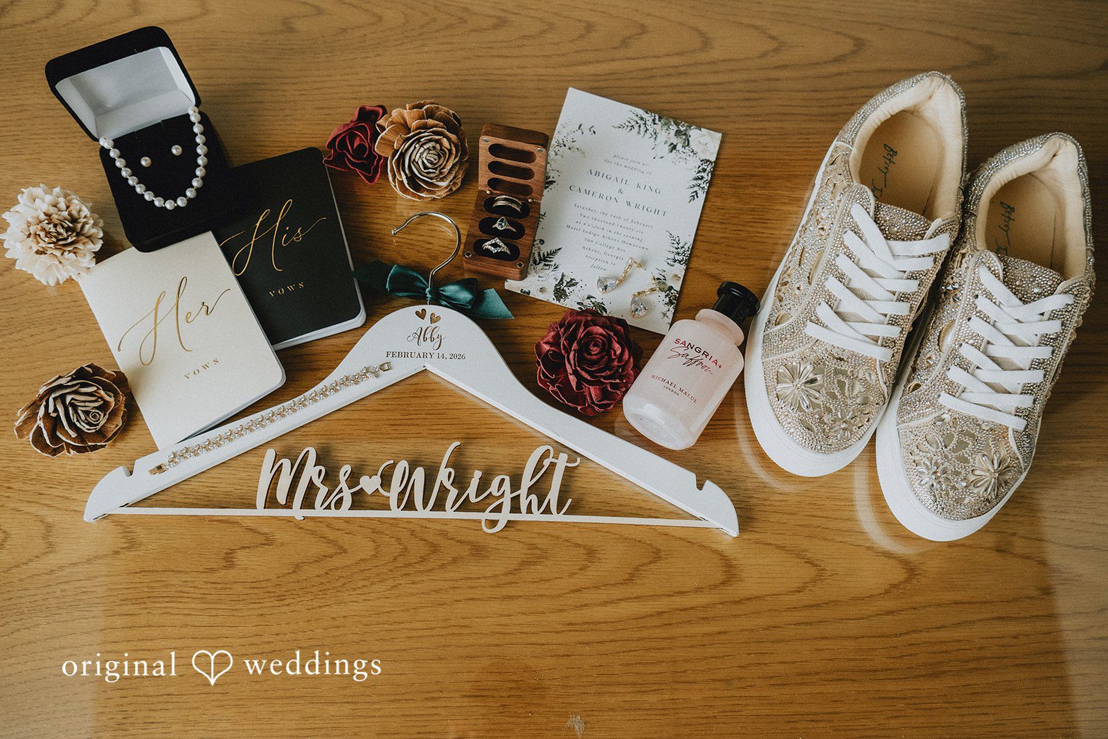 A collection of bridal accessories, including white sneakers, a personalized hanger, and Jewellery