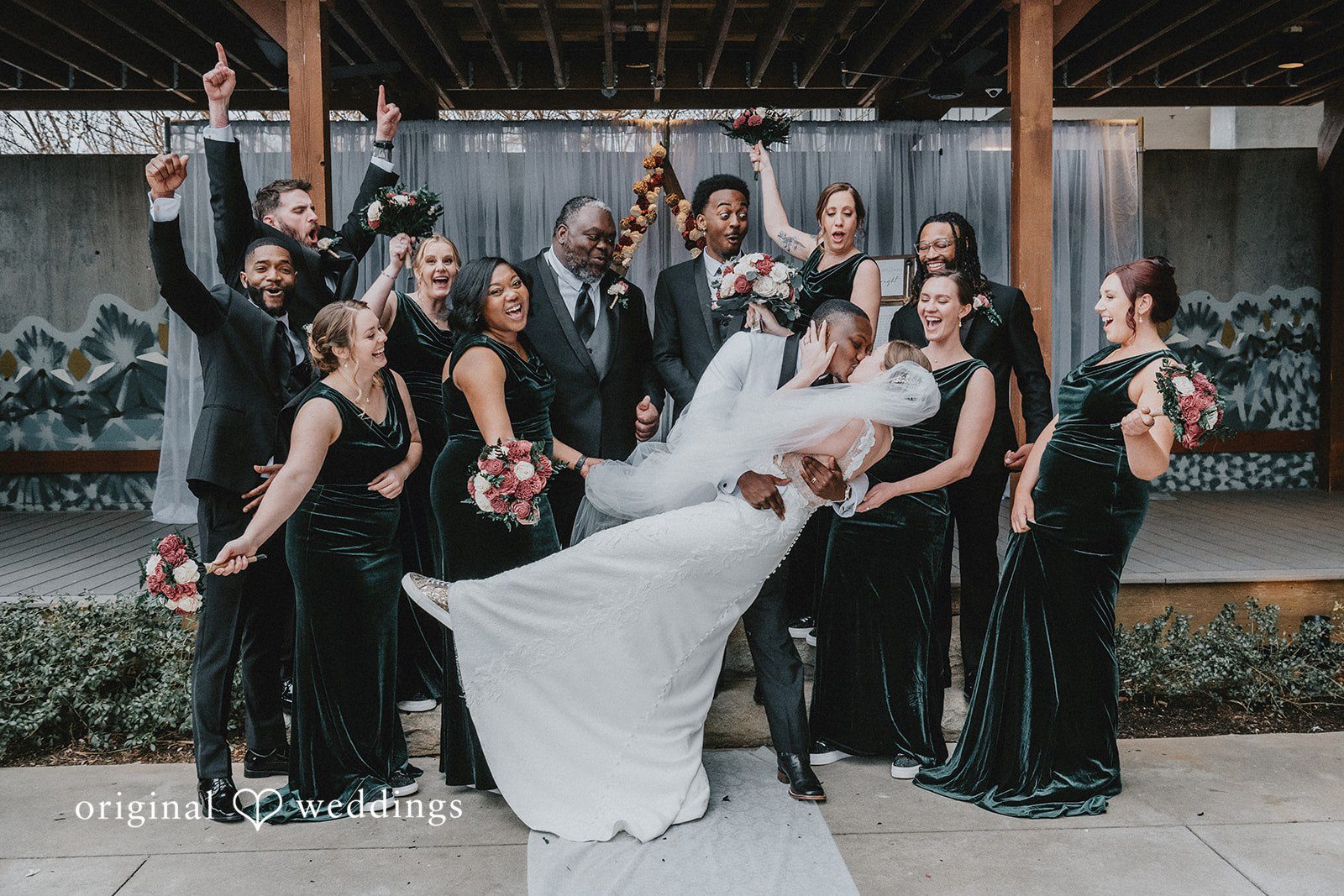 Couple posing bridesmaids and groomsmen at Hotel Indigo Athens.