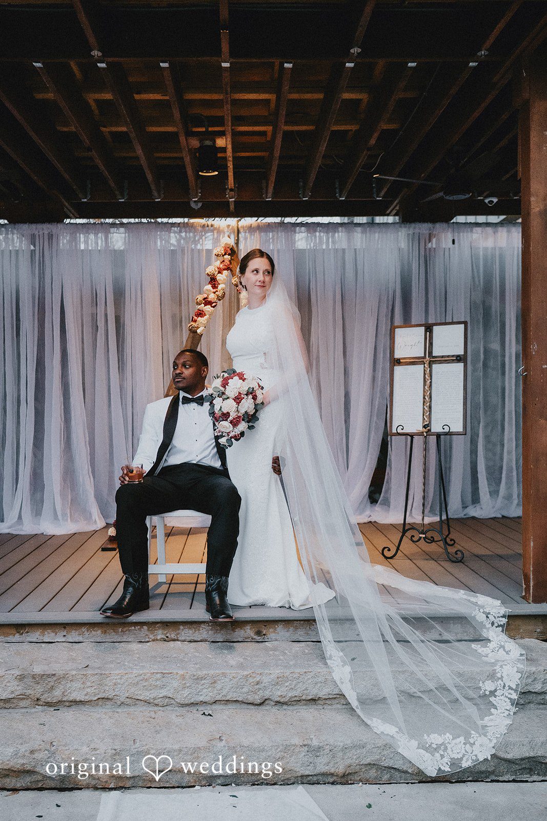 The bride and groom posing together.