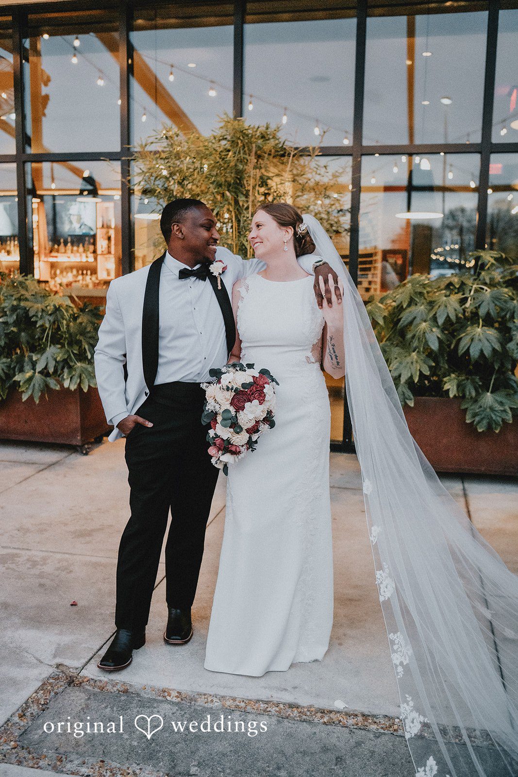 The bride and groom posing together.