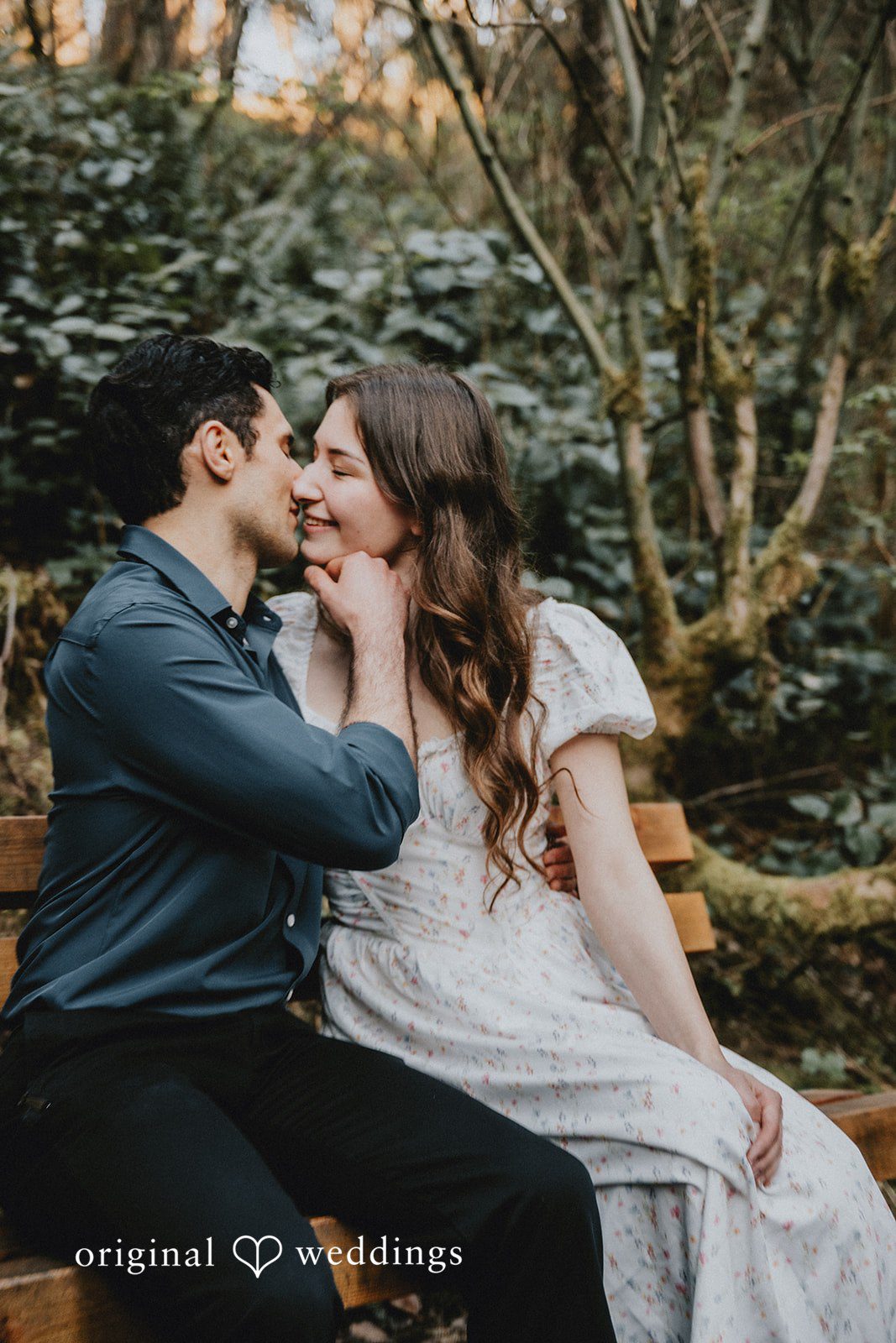 The couple takes a kiss at the garden
