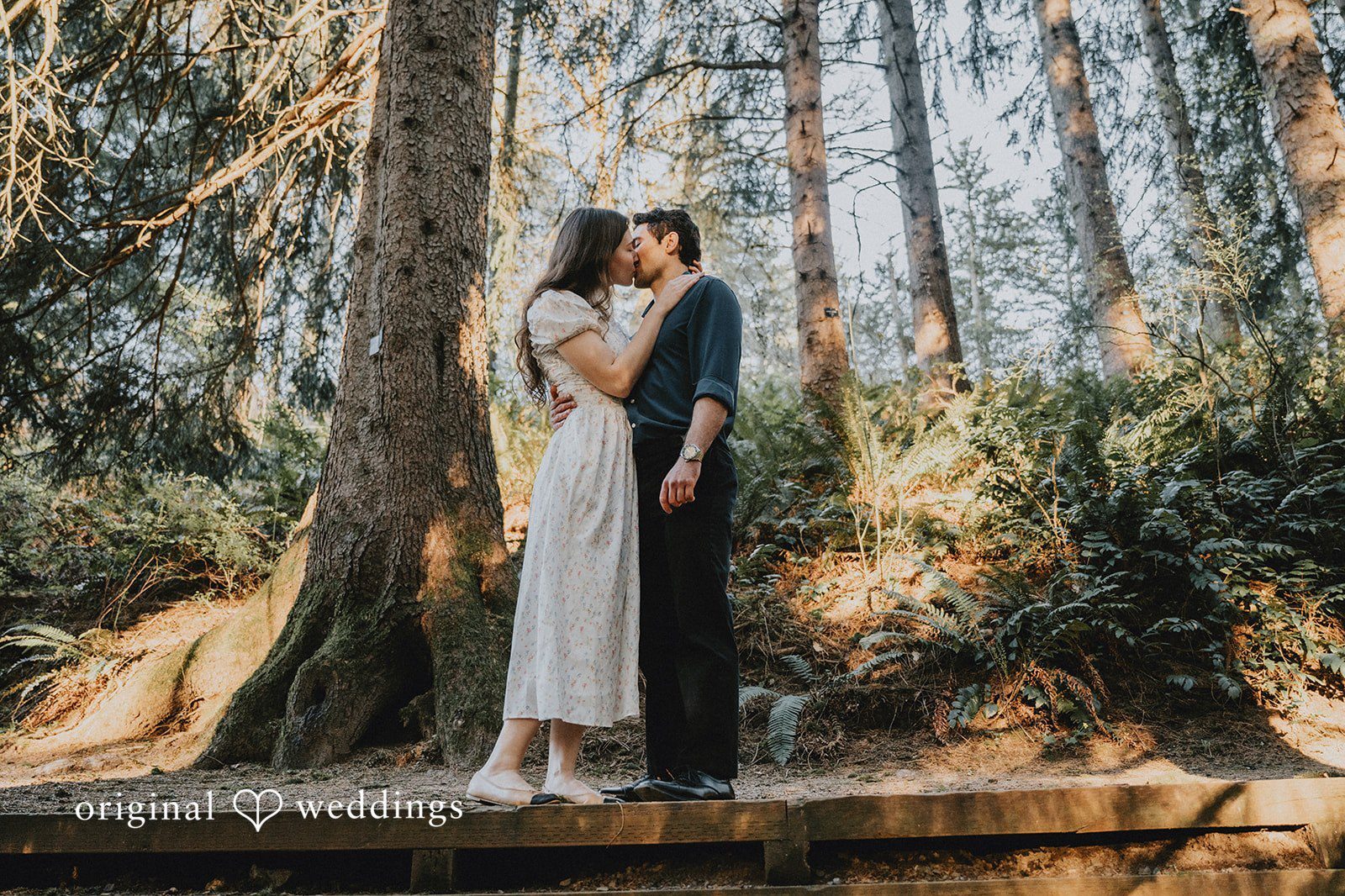 Our Portland wedding photographers at Original Weddings captured the couple as they shared a romantic kiss at Hoyt Arboretum