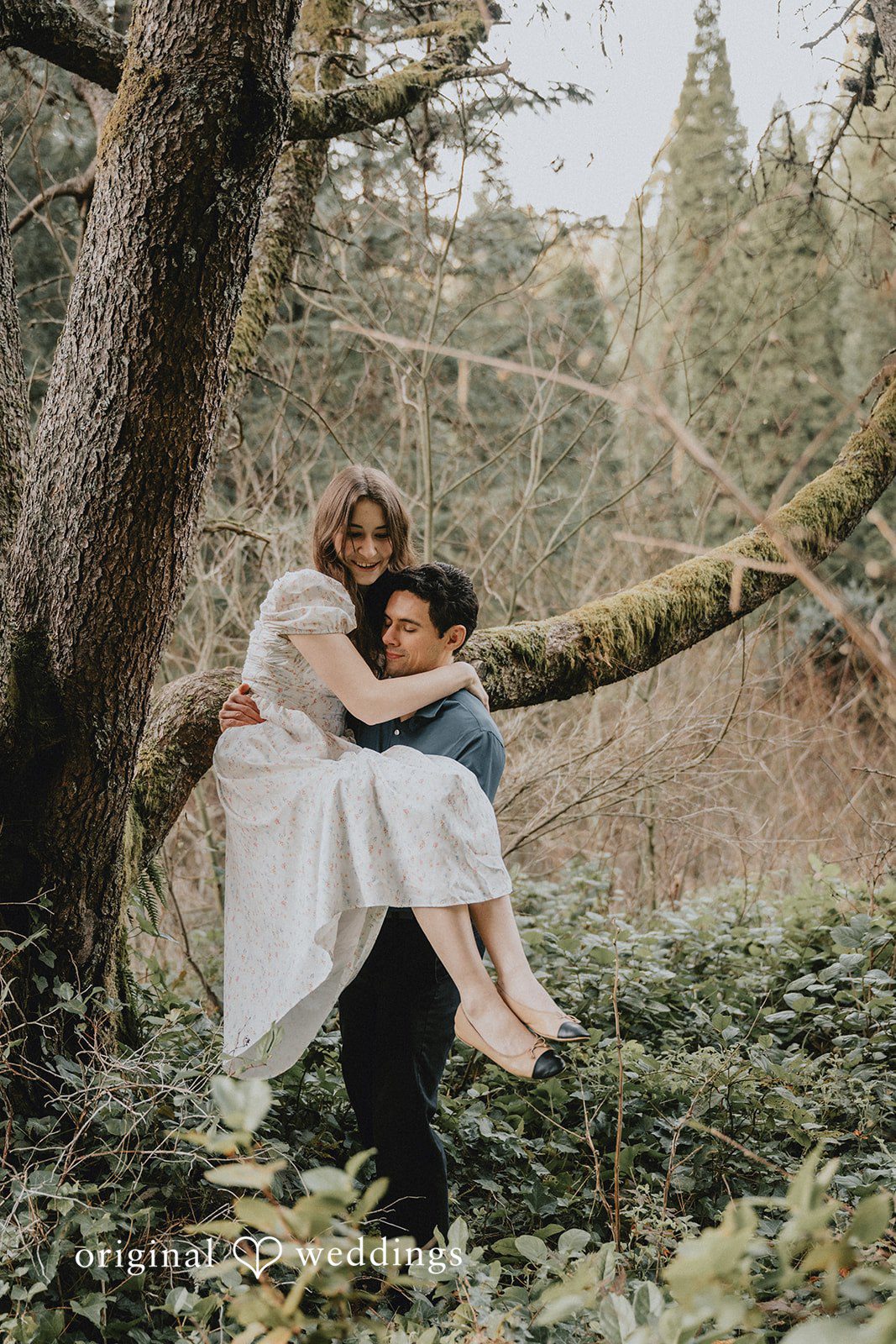 The groom lifts the bride