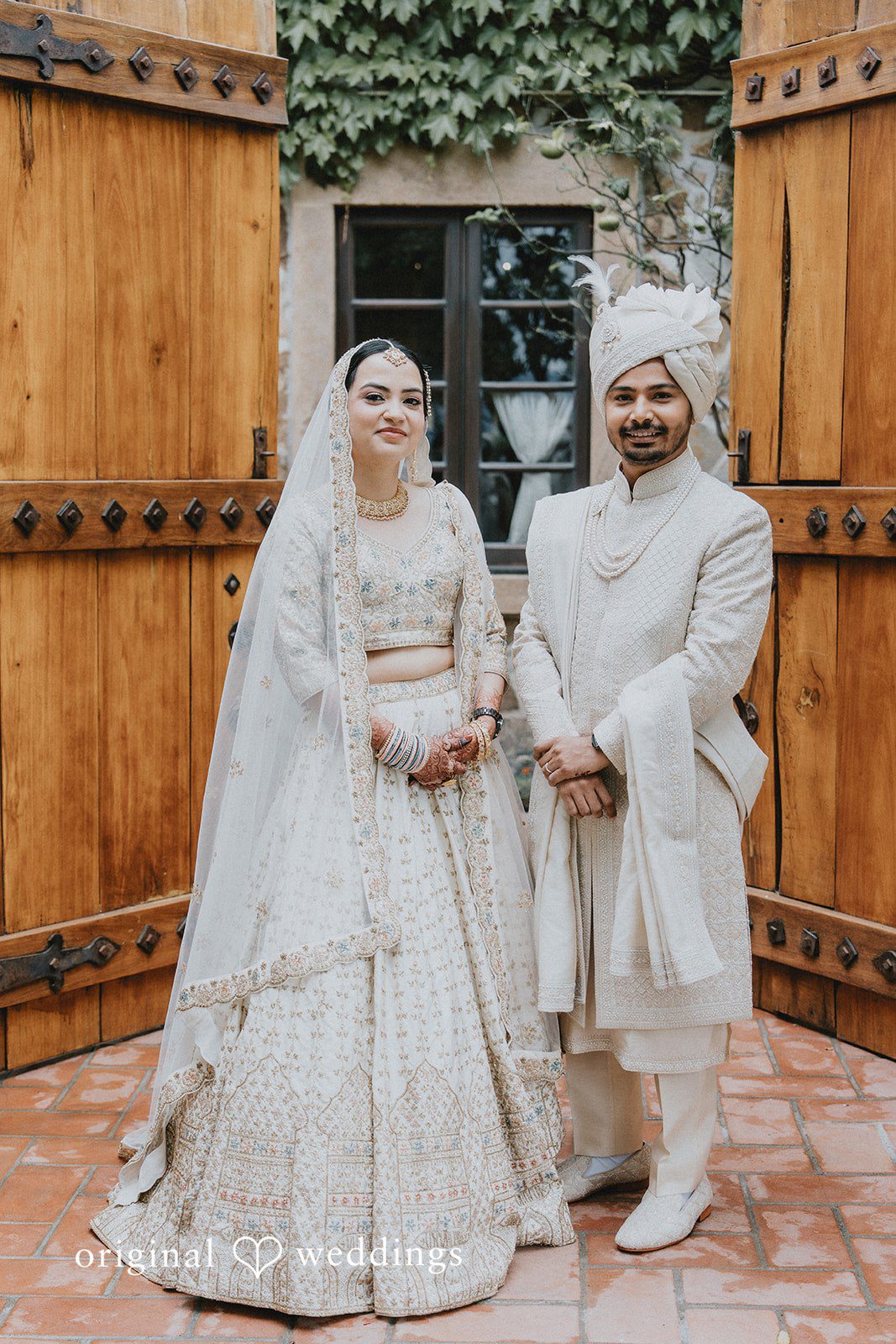 Chandrakant + Sumbul Bride and groom posing together during outdoor portraits
