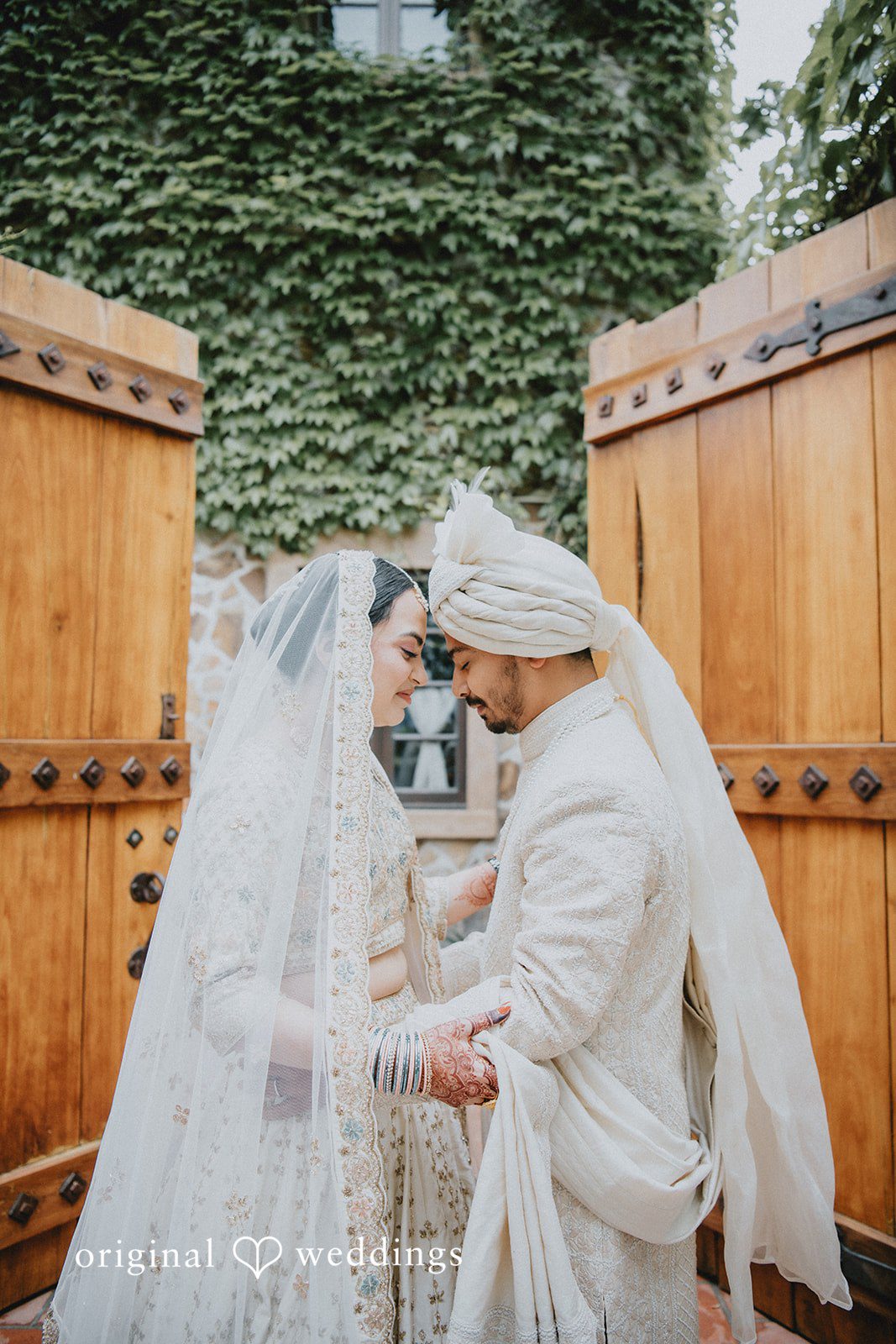 Chandrakant + Sumbul Bride and groom embracing for the first time during portraits