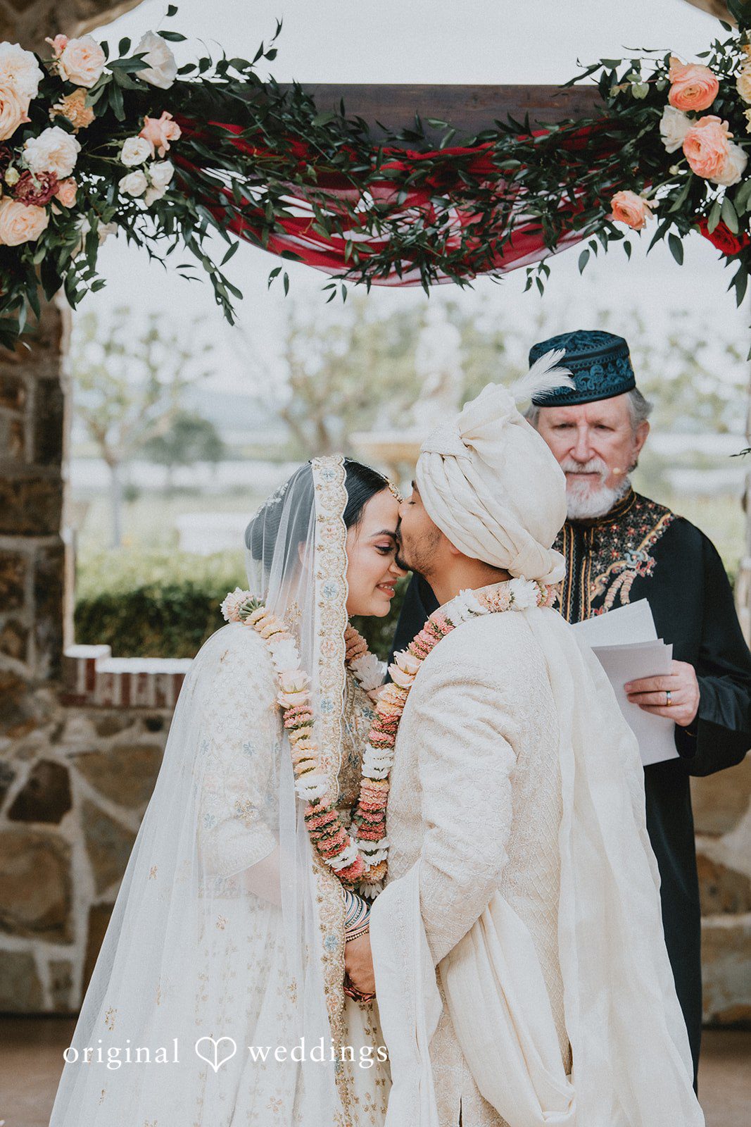 Chandrakant + Sumbul Groom kissing the bride after exchanging vows