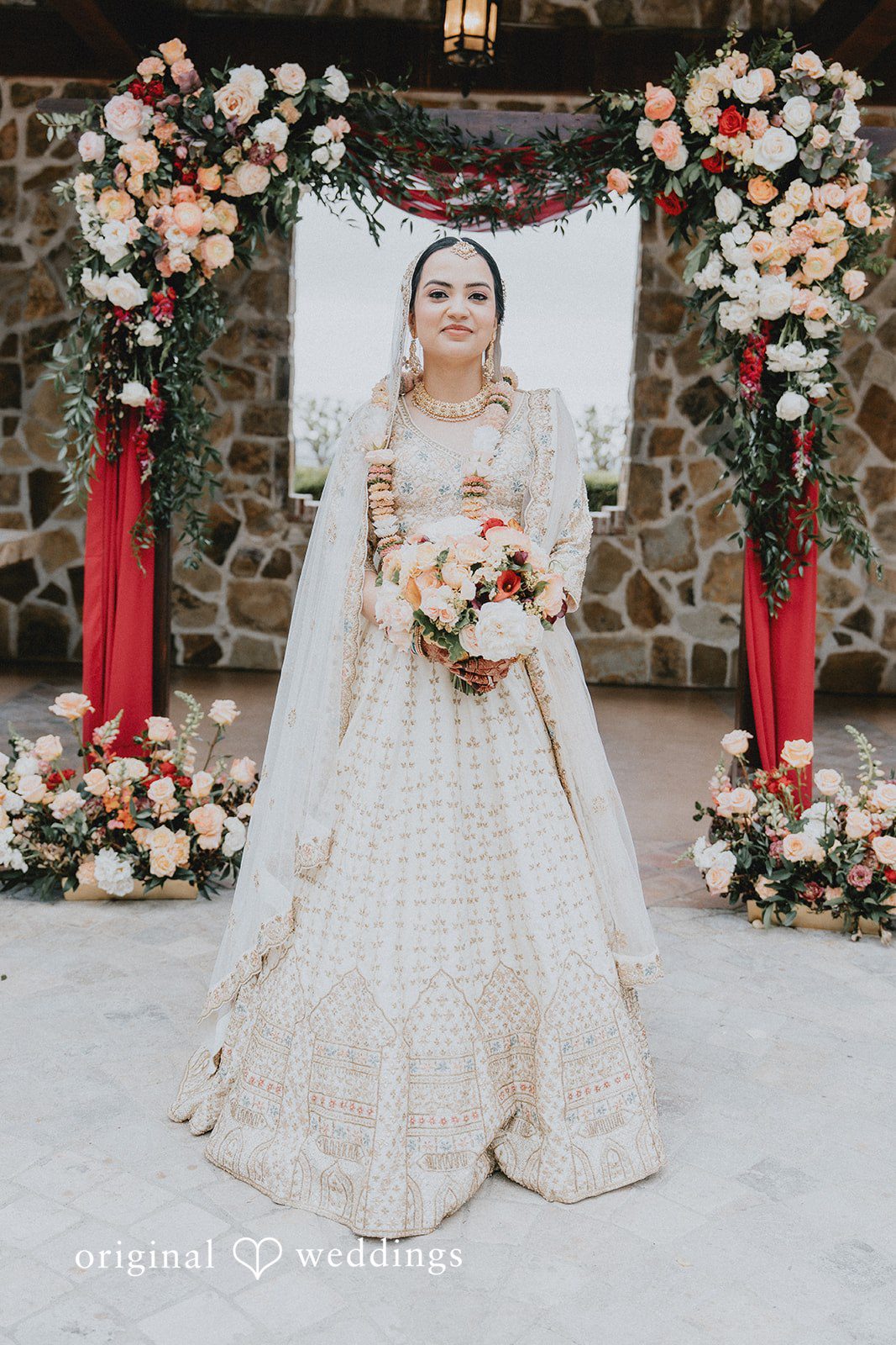Chandrakant + Sumbul Bride holding her bouquet during wedding portraits