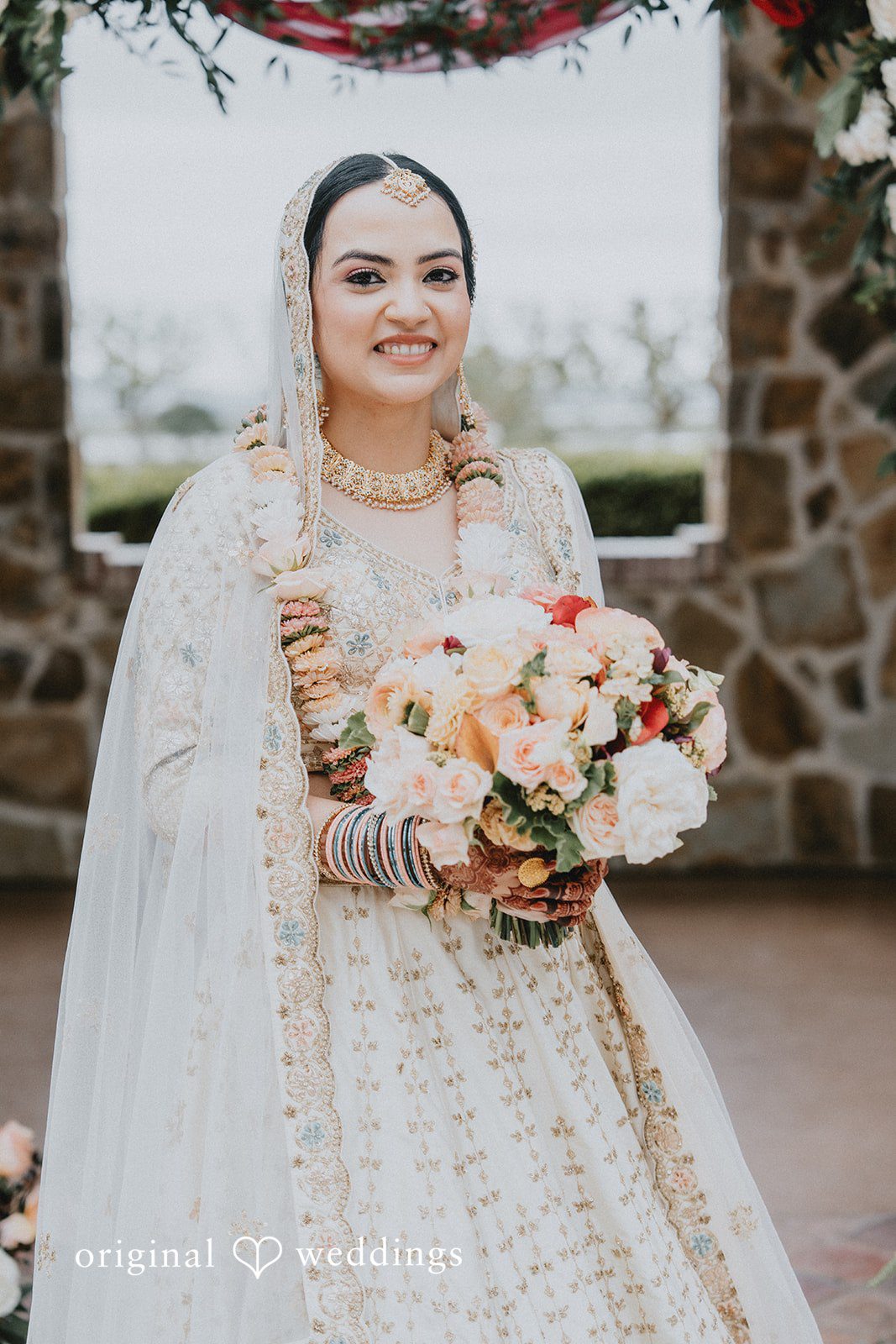 Chandrakant + Sumbul Bride posing outdoors with floral details after getting ready