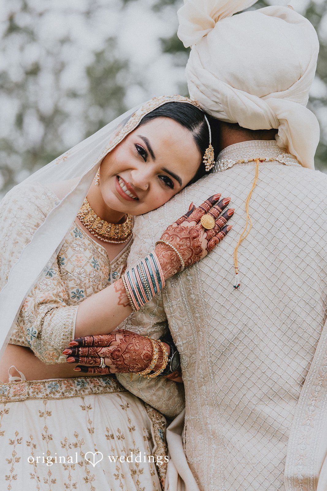 Chandrakant + Sumbul Groom facing away while the bride poses during wedding portraits