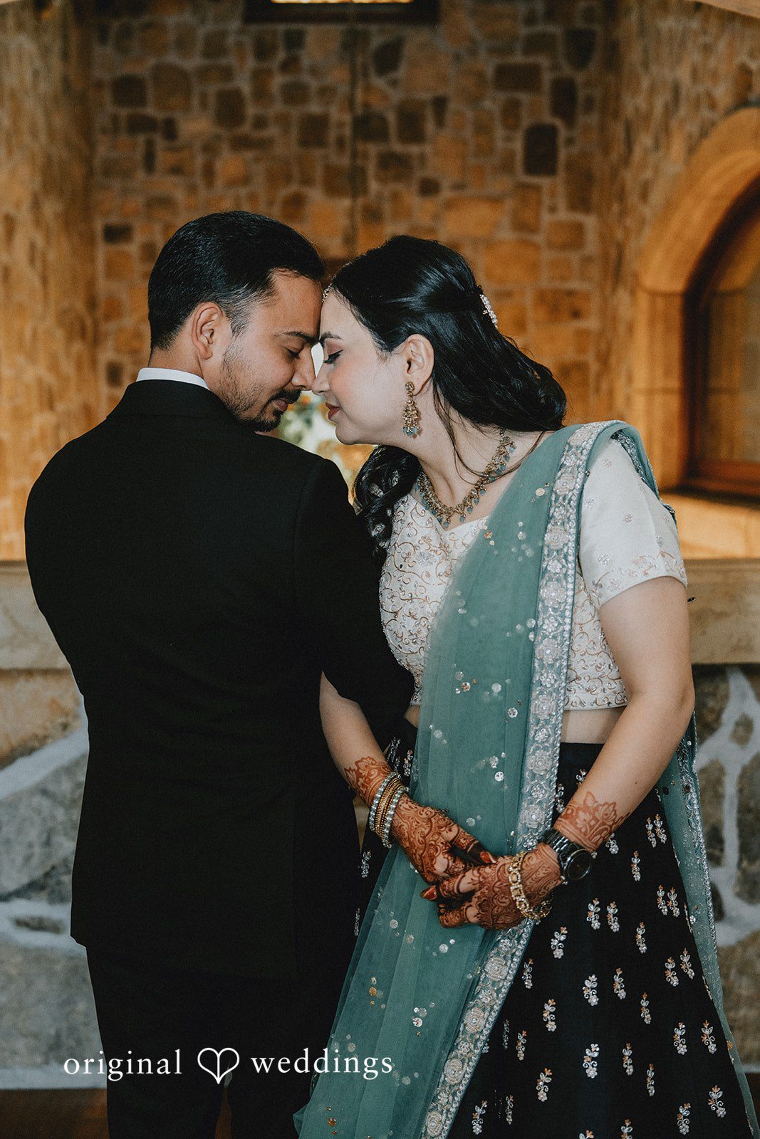 Chandrakant + Sumbul Bride and groom posing together during the reception celebration
