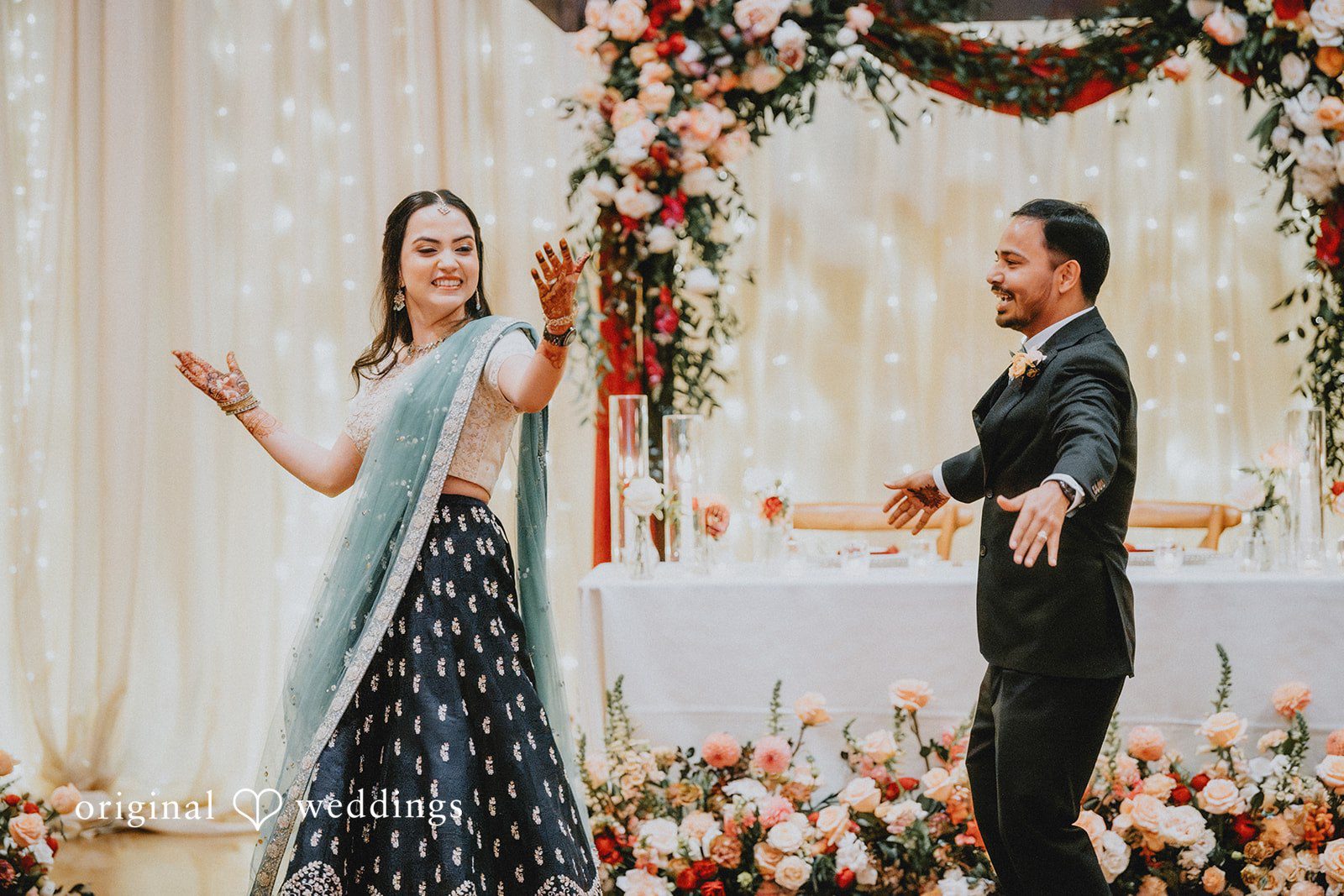 Chandrakant + Sumbul Bride and groom playing traditional wedding games during the reception