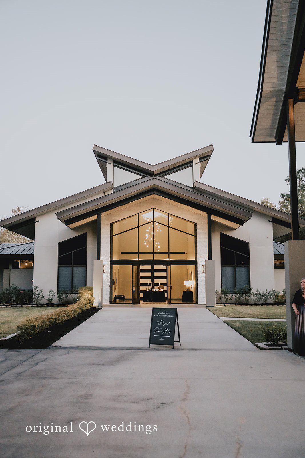 Modern white venue look with large glass entrance at Jennings Trace.