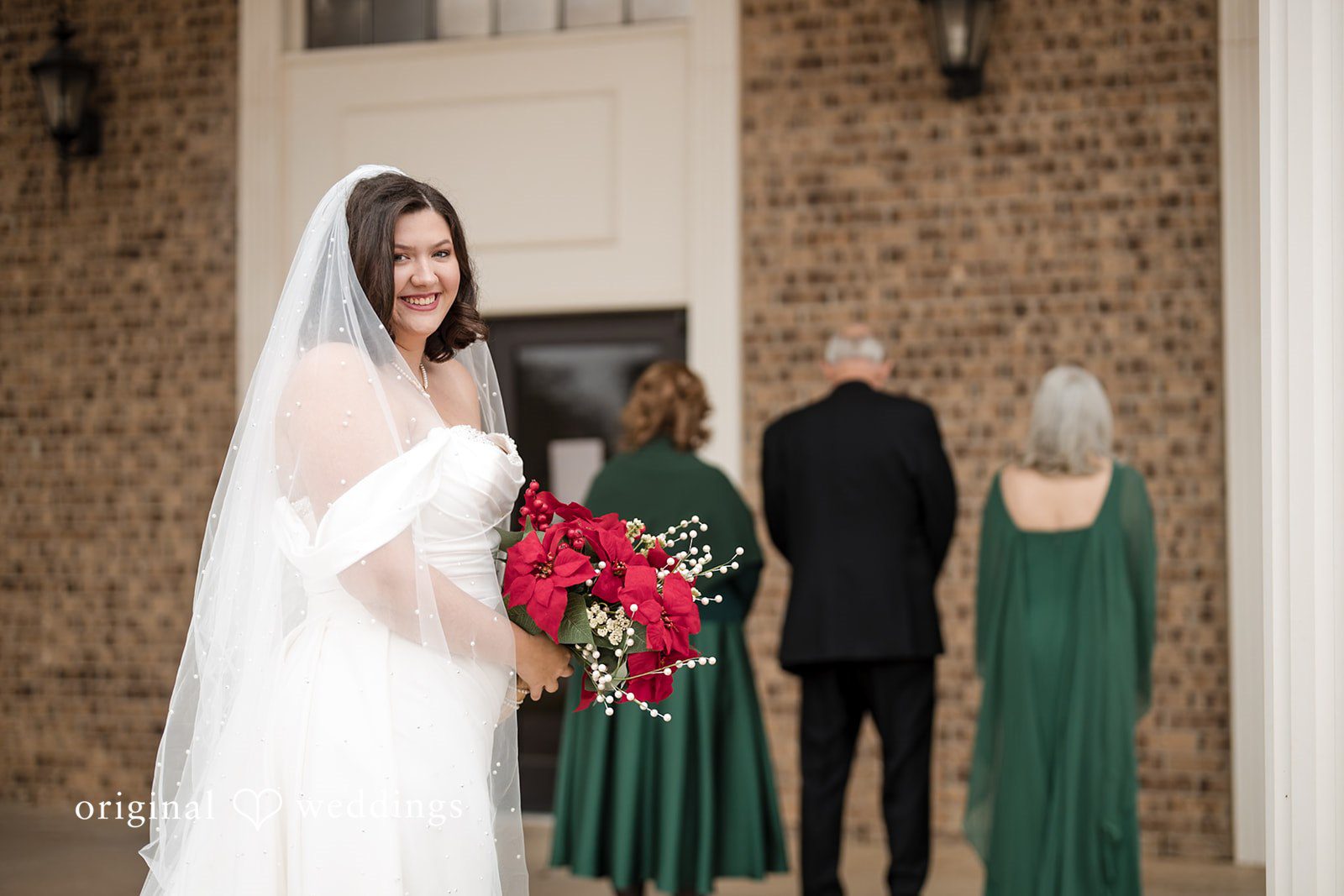 The bride about to unveil herself to her family