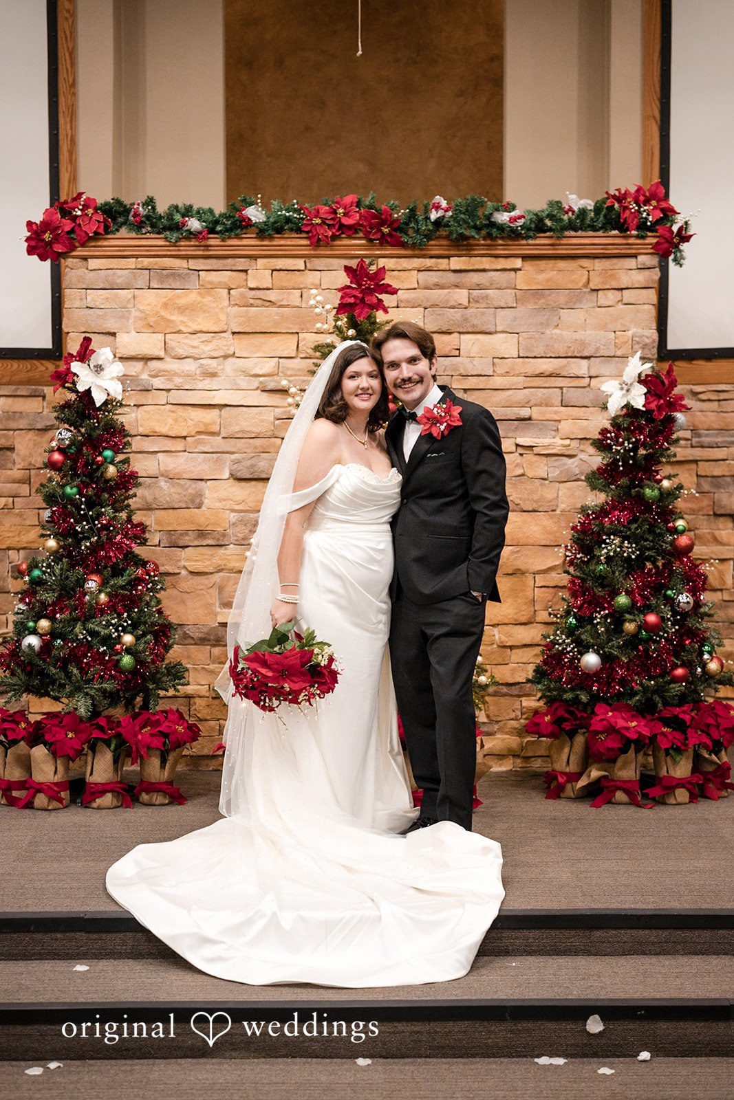 A stunning portrait of the couple by the altar