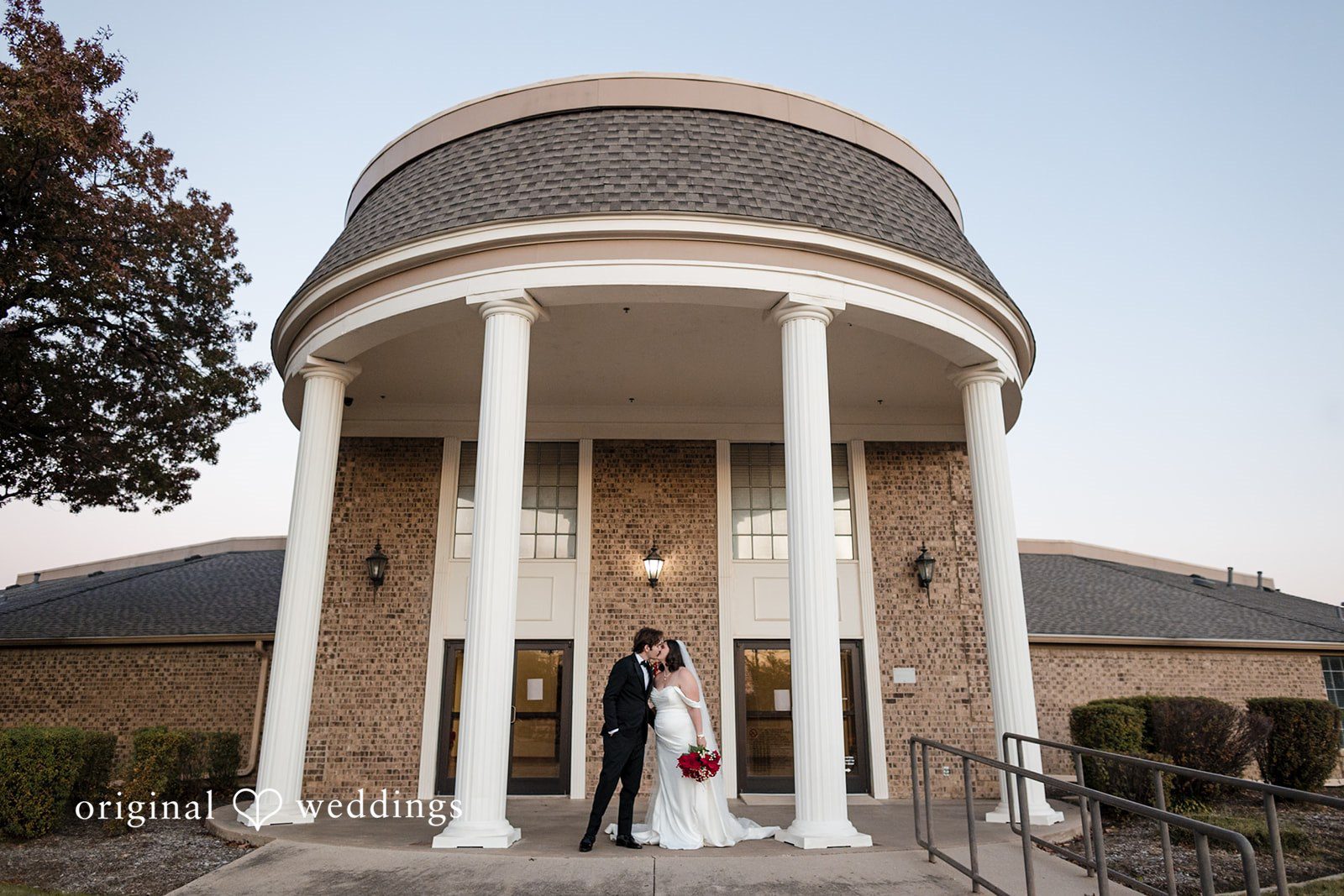 A romantic portrait of the couple in front of the Keller Church of Christ