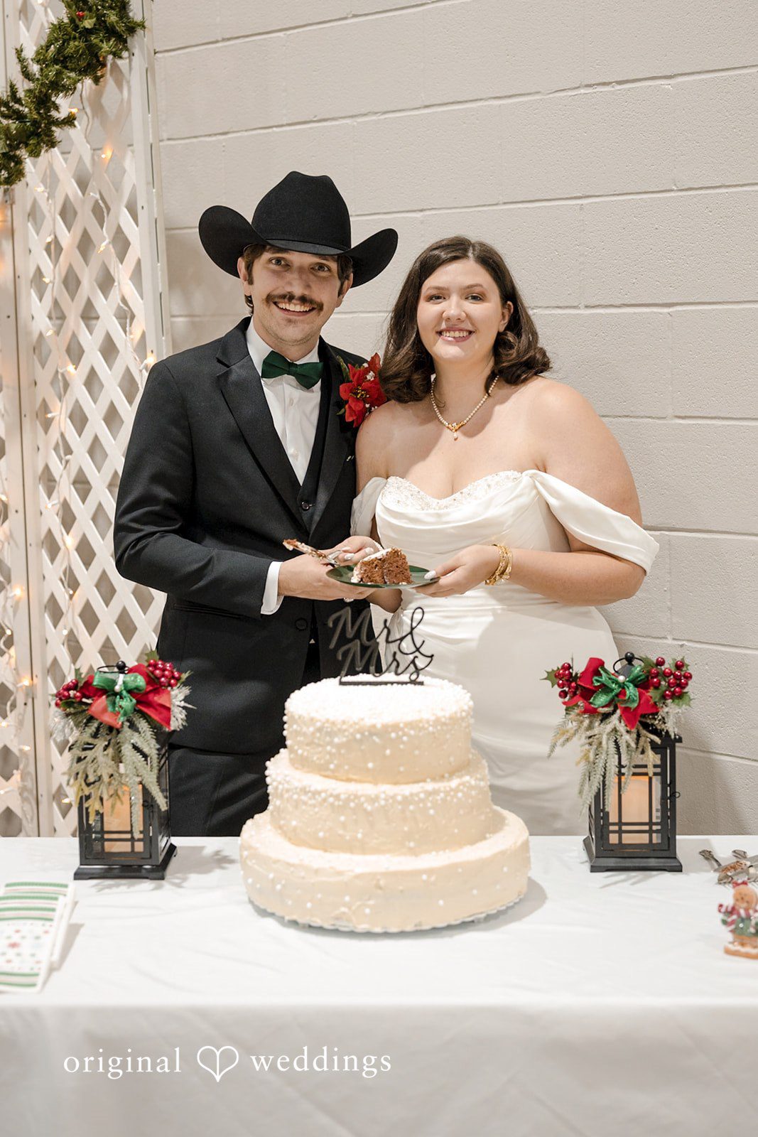 The couple cuts their wedding cake