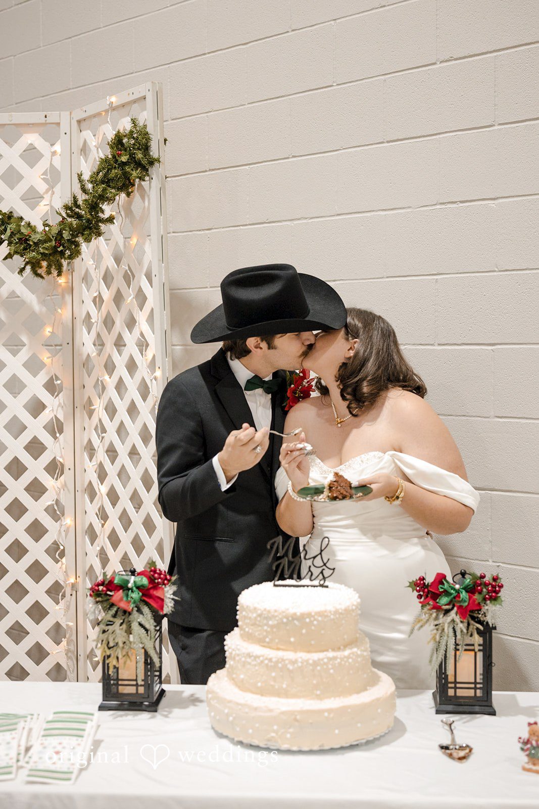 The couple takes a romantic kiss as they feed each other
