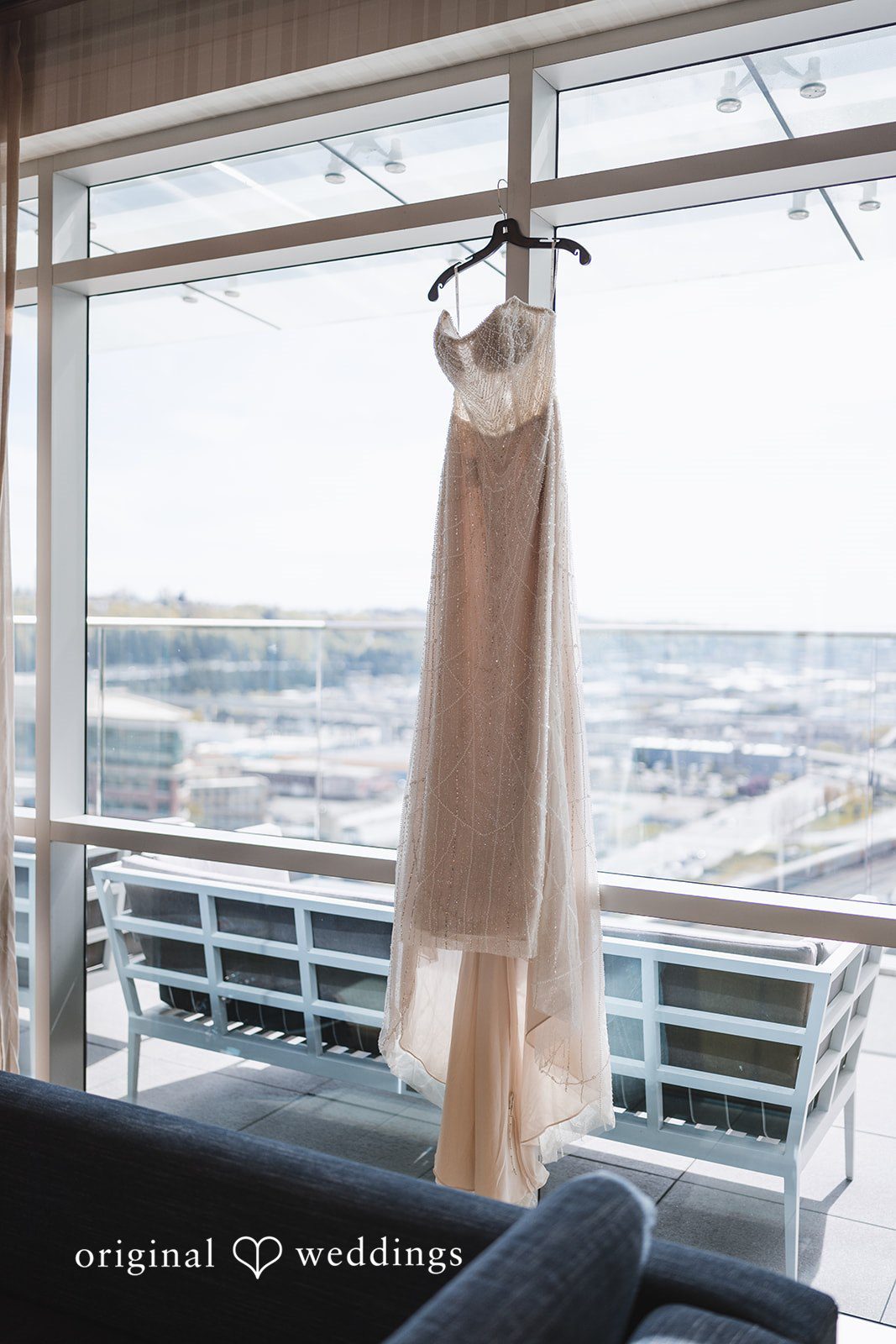 Nicolas + Nicole Wedding dress hanging before the ceremony begins