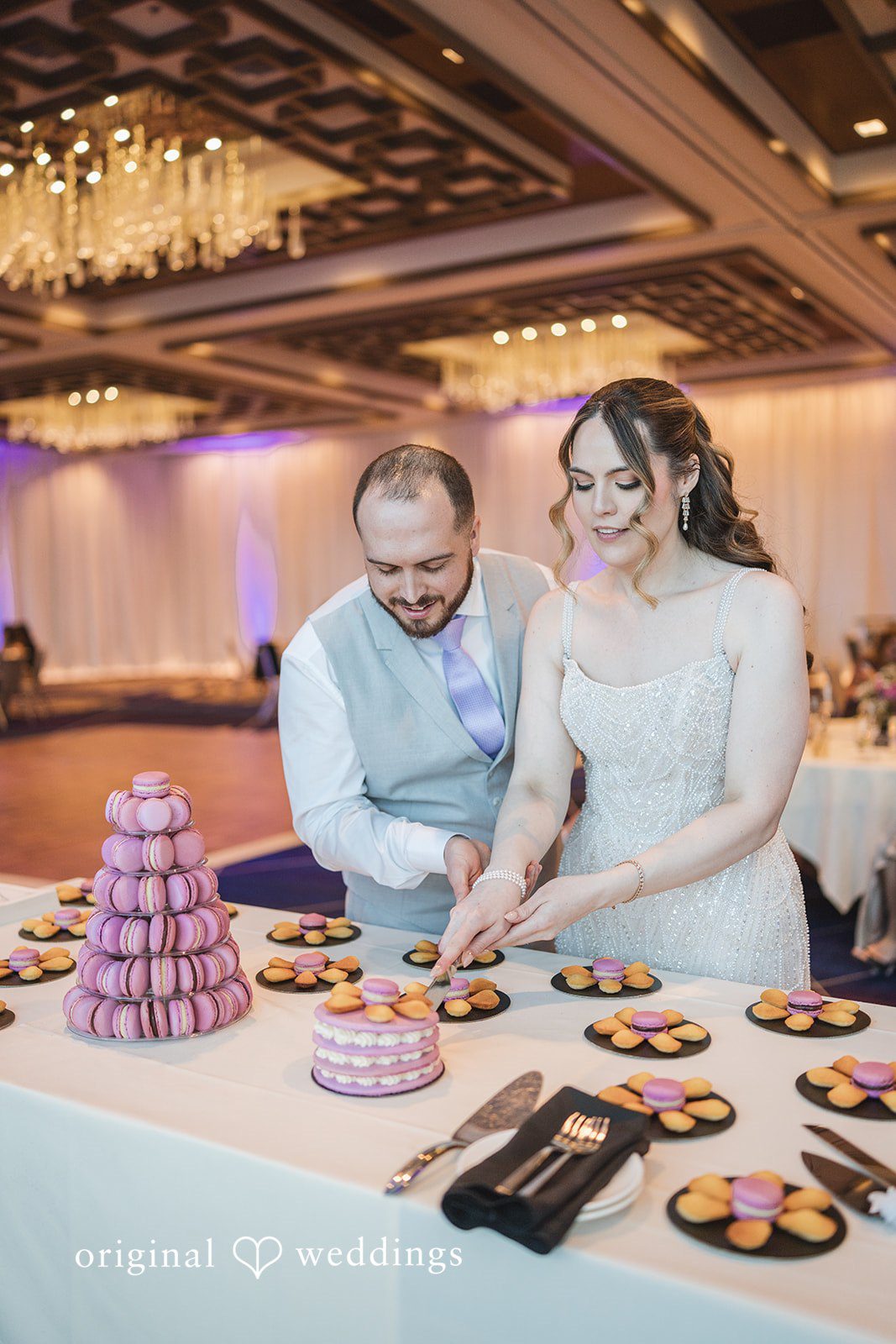 Nicolas + Nicole Bride and groom cutting their wedding cake together