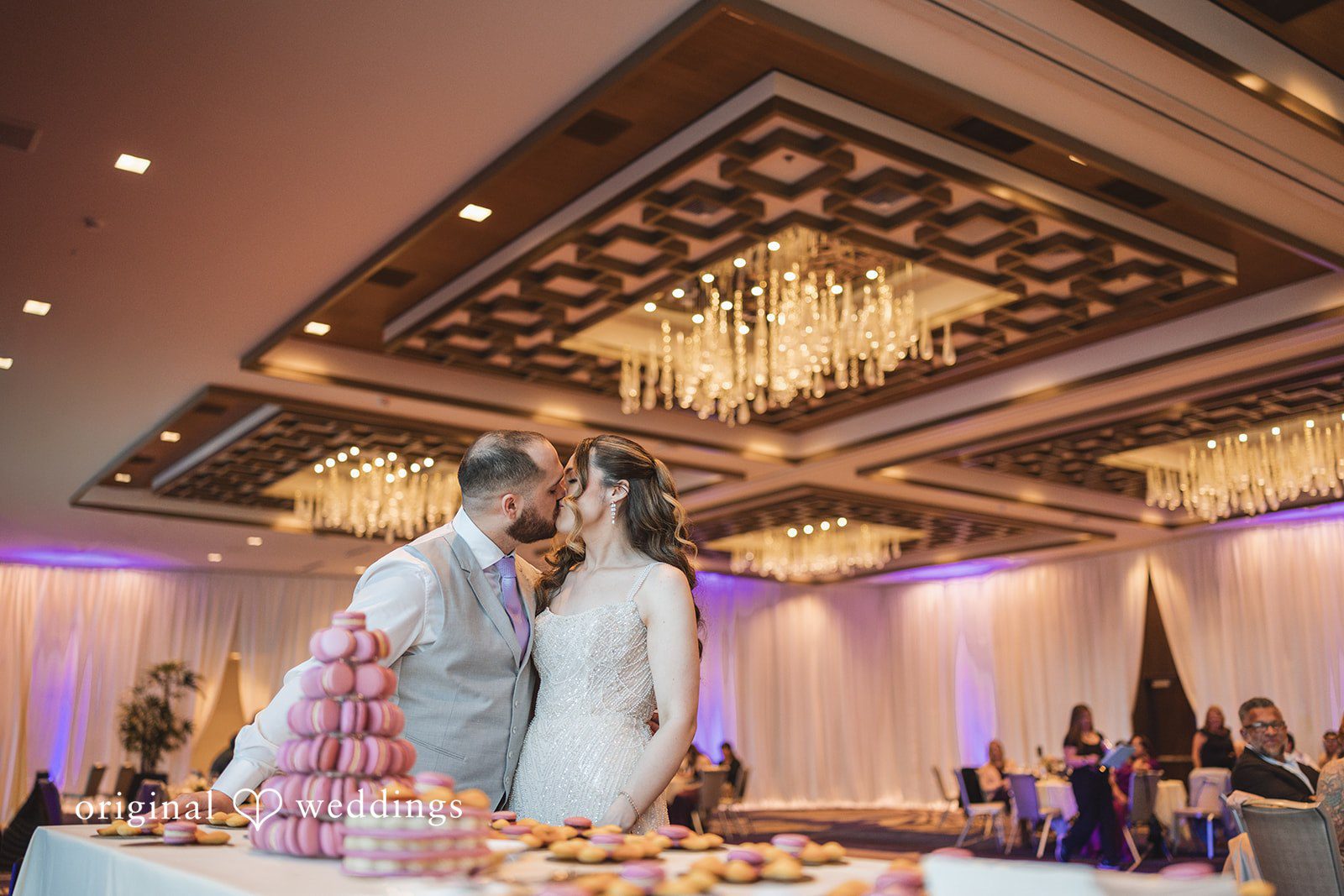 Nicolas + Nicole Bride and groom kissing after cutting the wedding cake